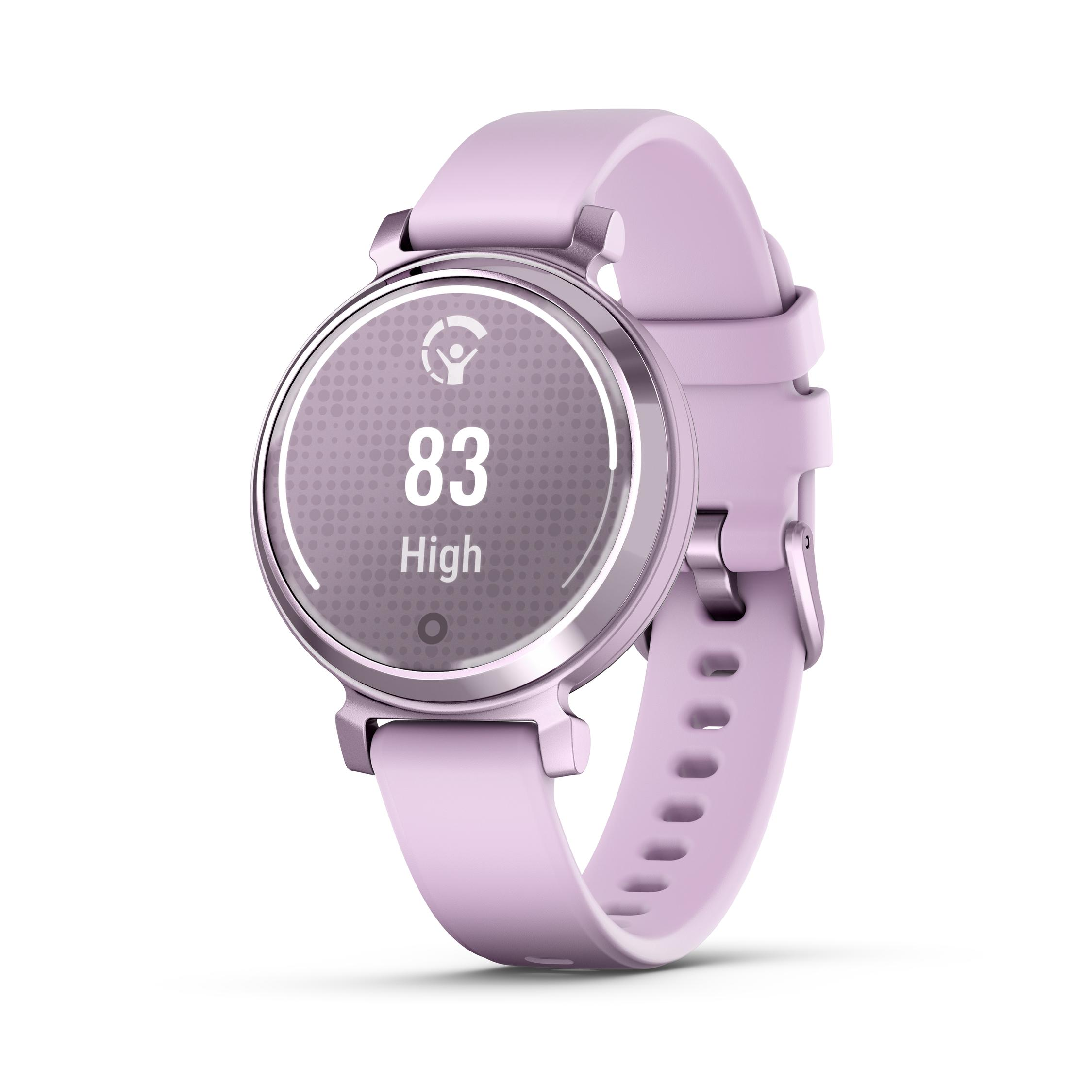 Smartwatch rose avec cadran rond affichant des mesures, sur surface blanche.