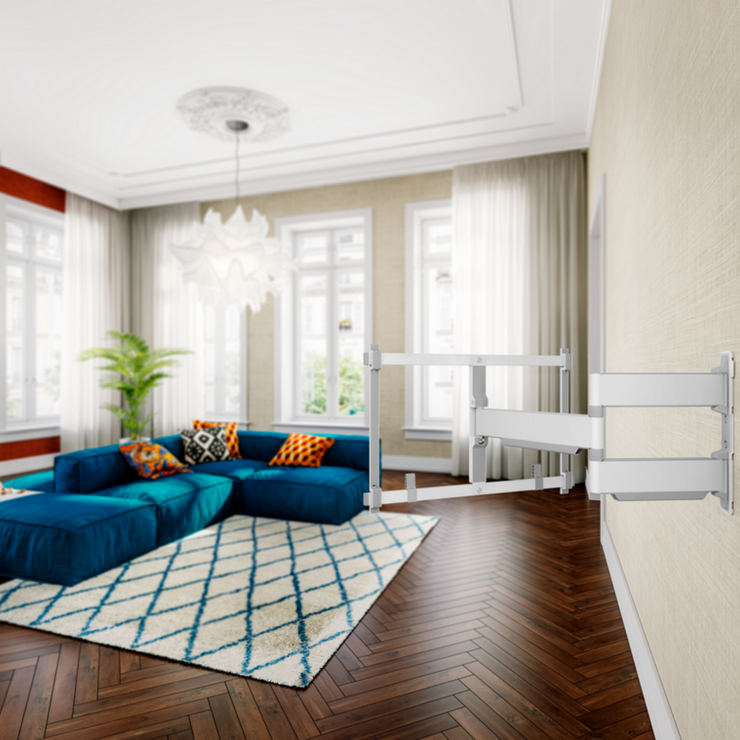 Woonkamer: blauwe bank, wit tapijt, wandbeugel voor tv en decoratieve items. Lichte, luchtige ruimte.