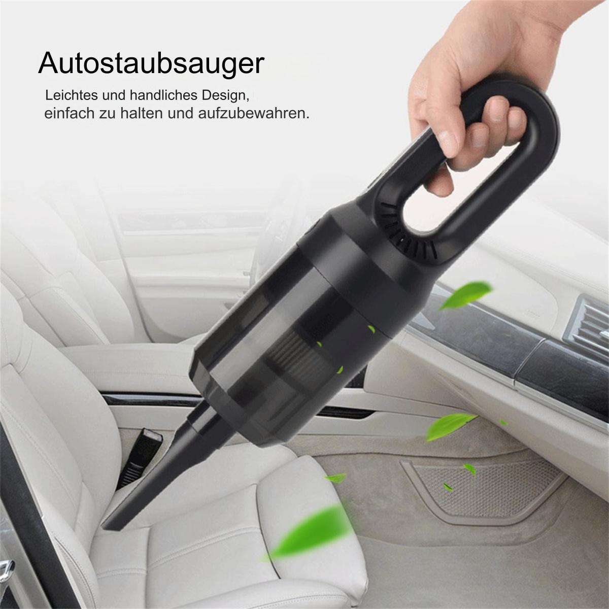 Hand hält einen schwarzen Handstaubsauger in einem Auto. Blätter in der Luft.