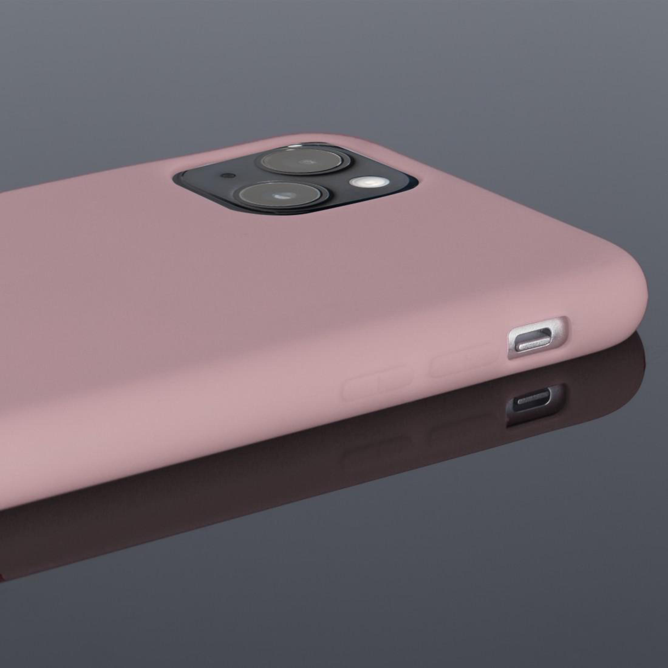 Zbliżenie na różowe etui na telefon z aparatami. Etui leży na odblaskowej szarej powierzchni.