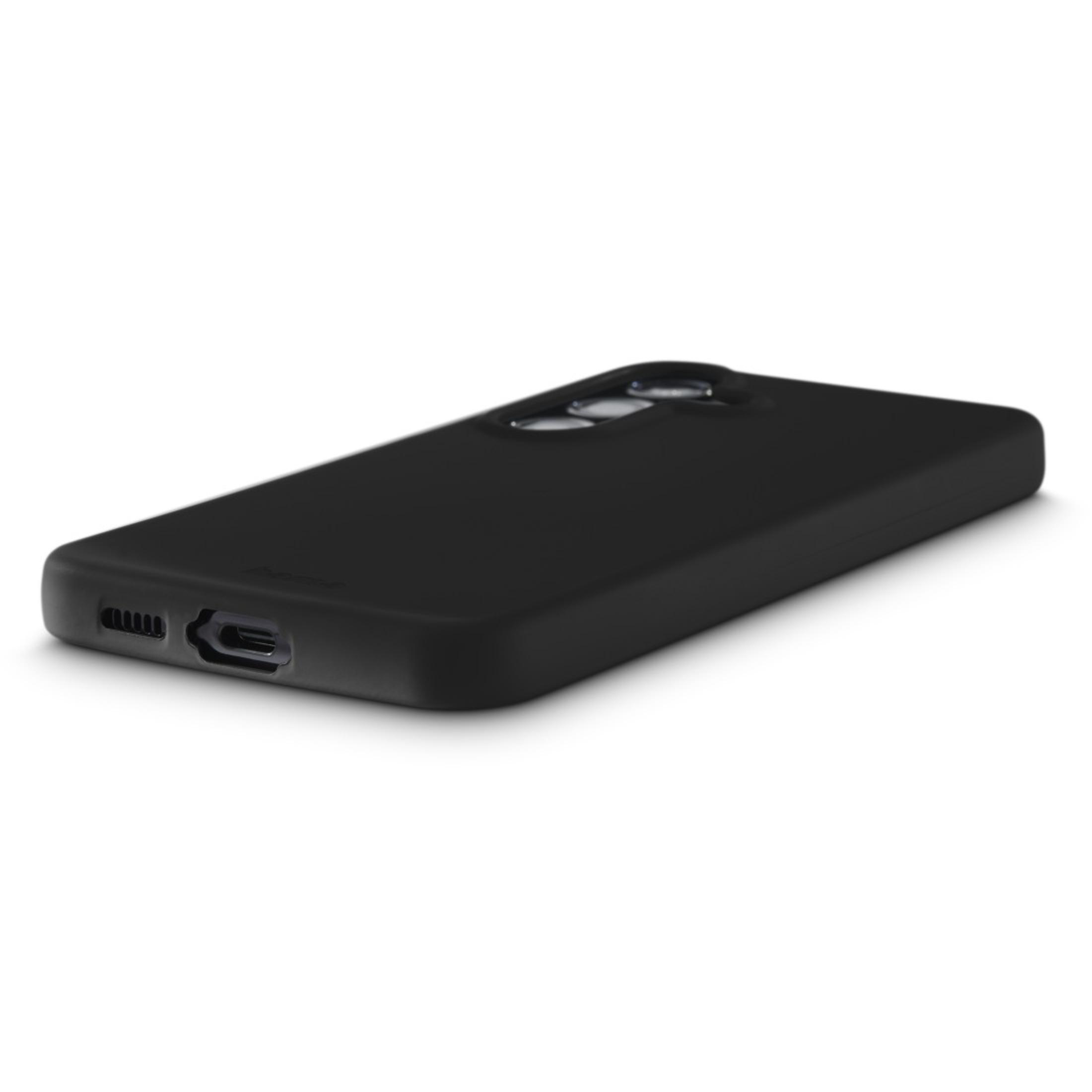 Coque de téléphone noire. Design lisse et simple, avec découpe caméra et ouvertures pour ports.