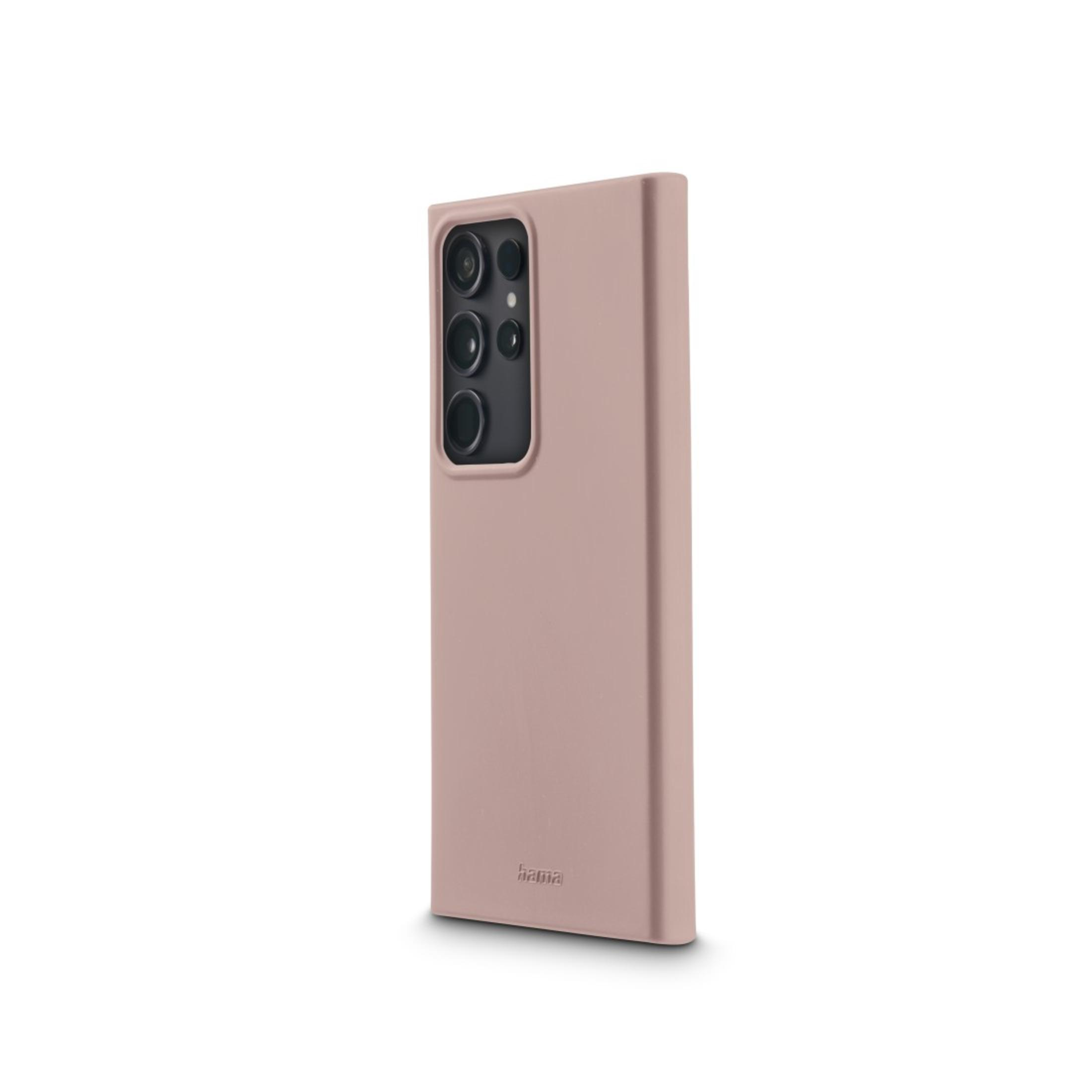 Coque de téléphone mauve avec module caméra noir. La marque 'hama' est visible.