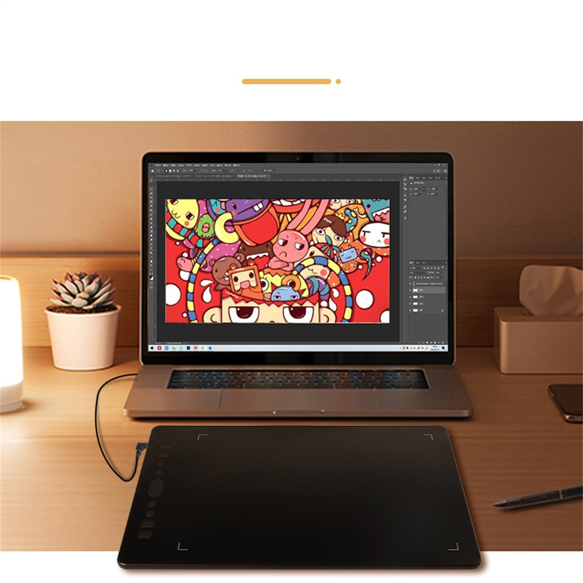 Laptop und Zeichentablett auf dem Schreibtisch. Laptop zeigt buntes digitales Kunstwerk.