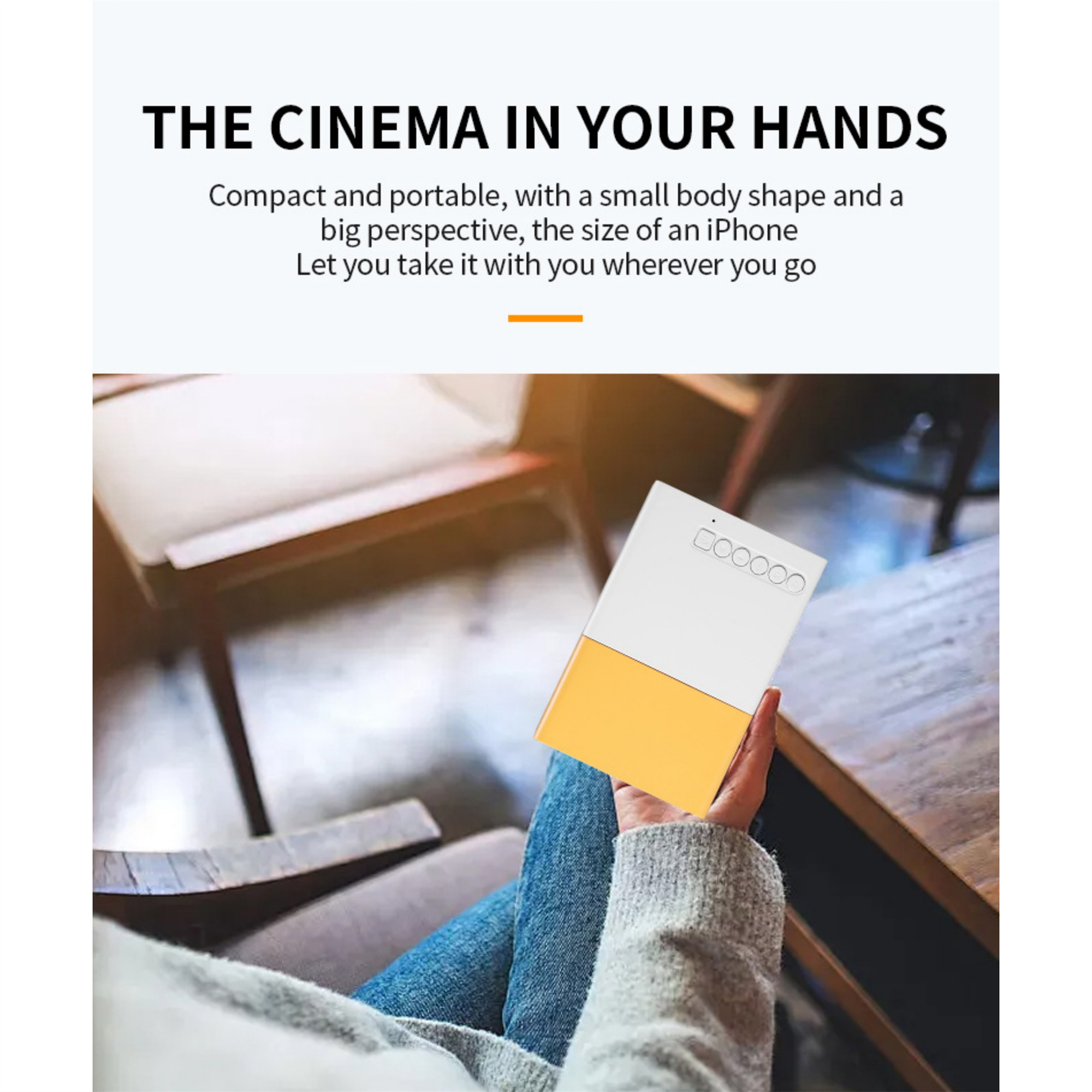 Person hält kleinen weißen und gelben Projektor. Text: "THE CINEMA IN YOUR HANDS"
