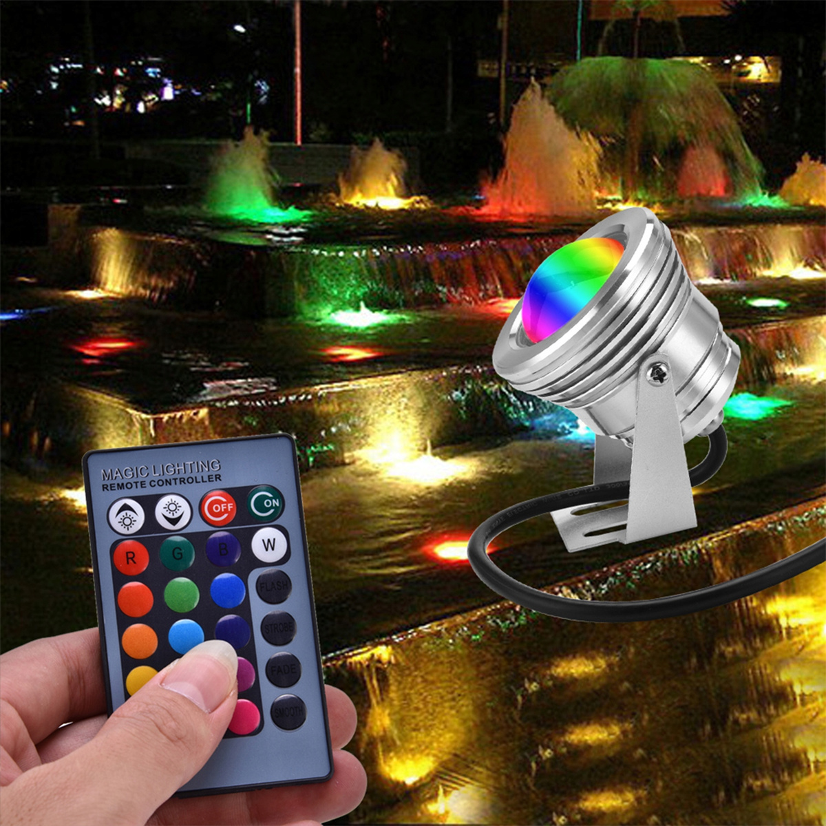 Eine Hand hält eine Fernbedienung neben einem Brunnen mit Regenbogenlichtern.