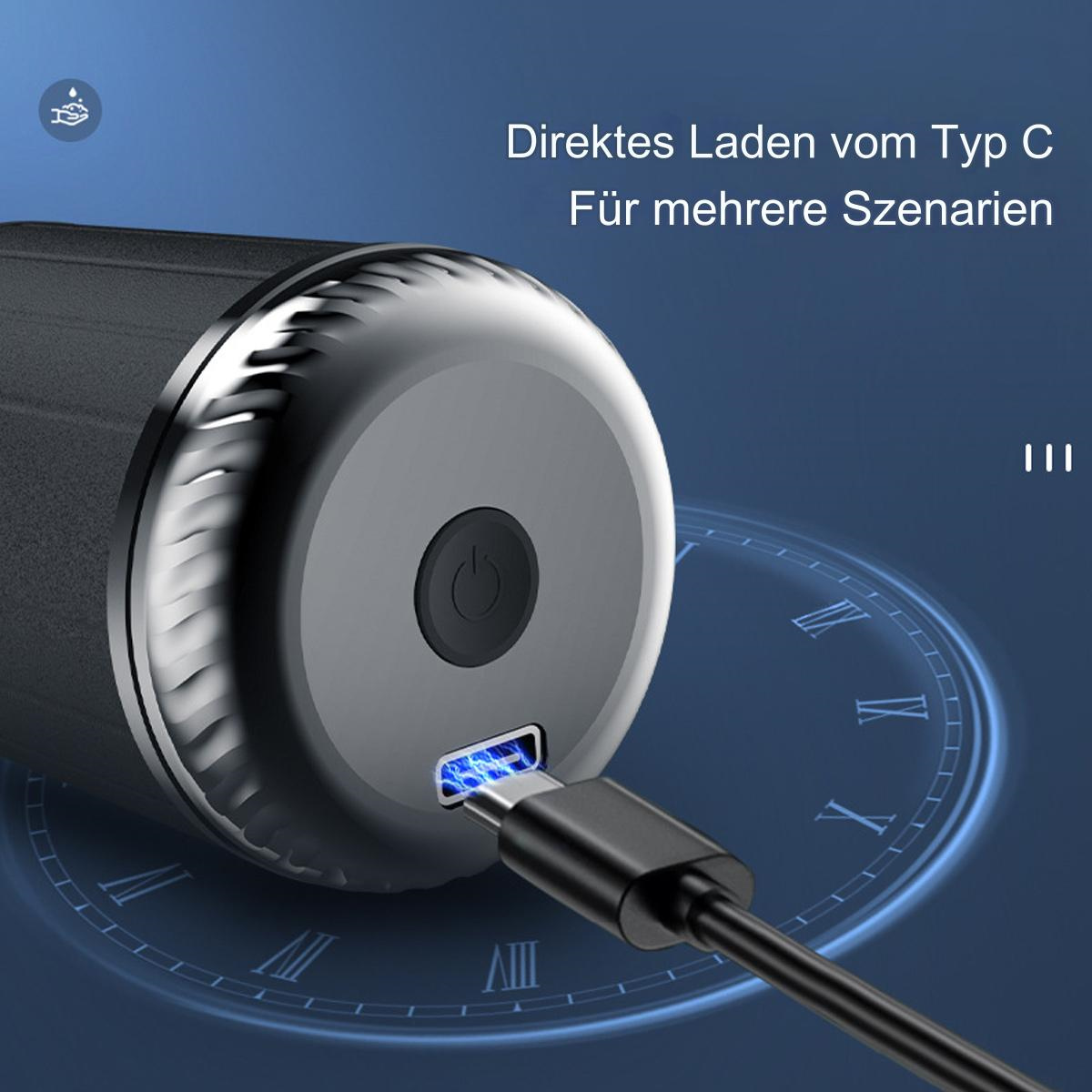 Ein schwarzes Gerät wird geladen. Ein blaues Licht zeigt das Laden an.