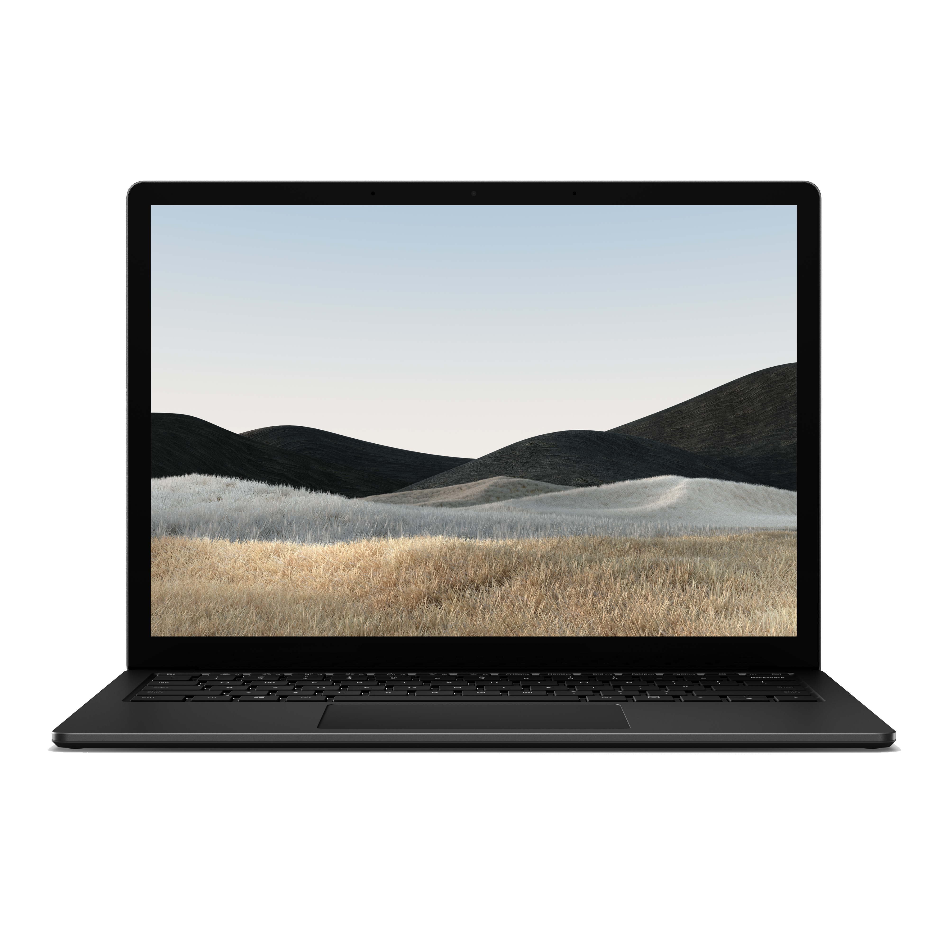 A black laptop with a screen displaying a landscape of rolling hills and a blue sky.