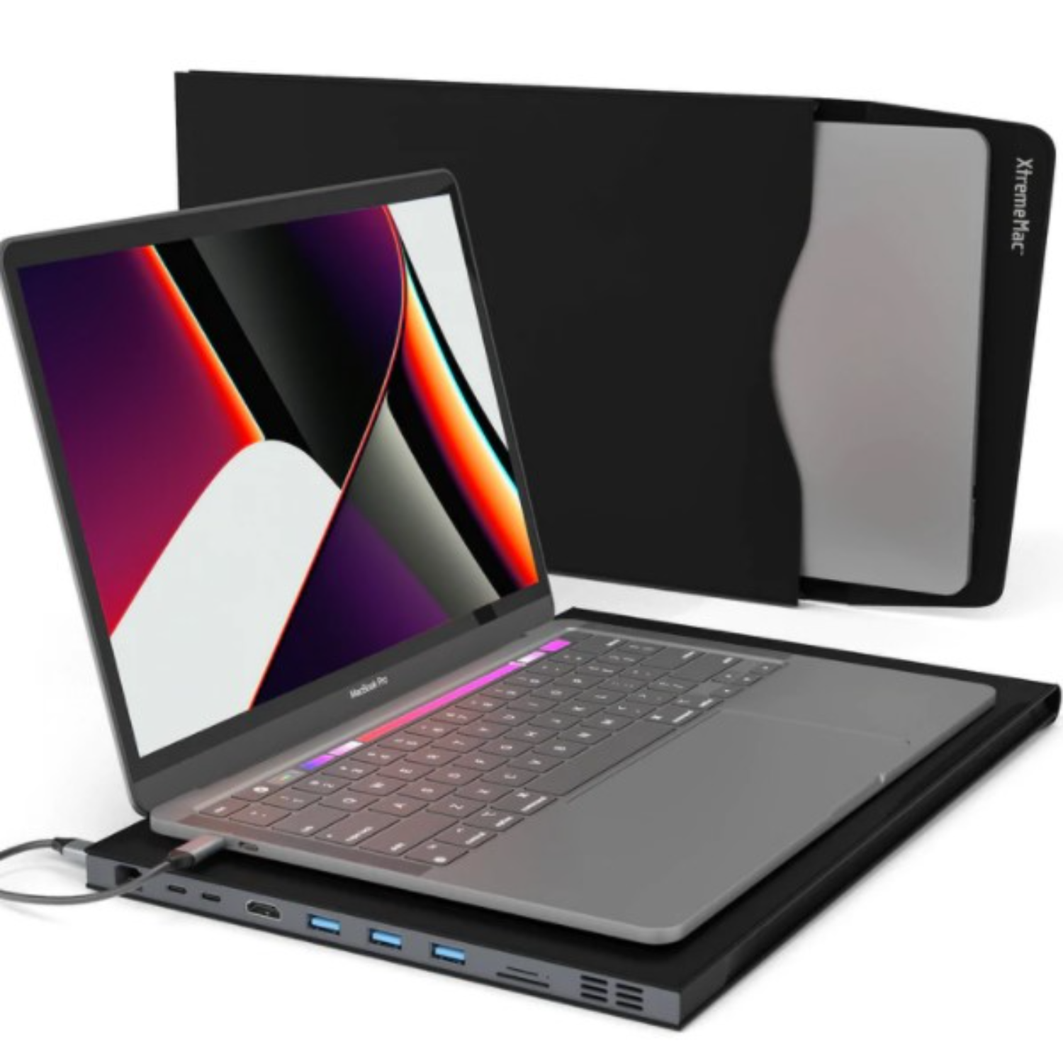 Laptop on a black base with connected ports, with a black sleeve in the background.