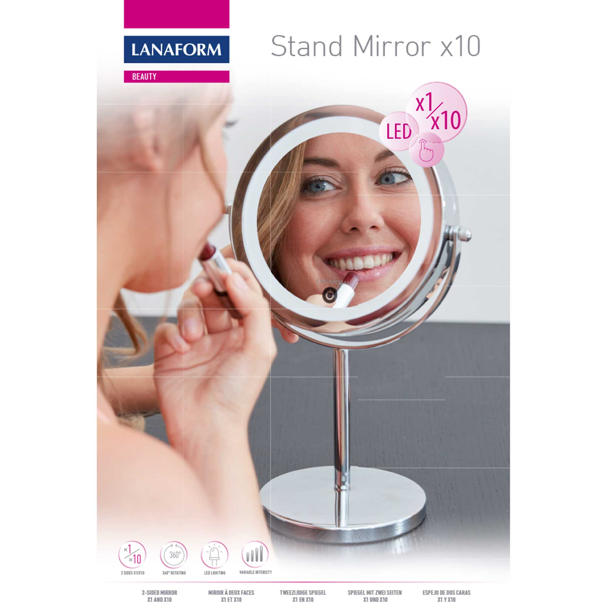 A woman applies lipstick in a lighted stand mirror labeled 'Stand Mirror x10'.