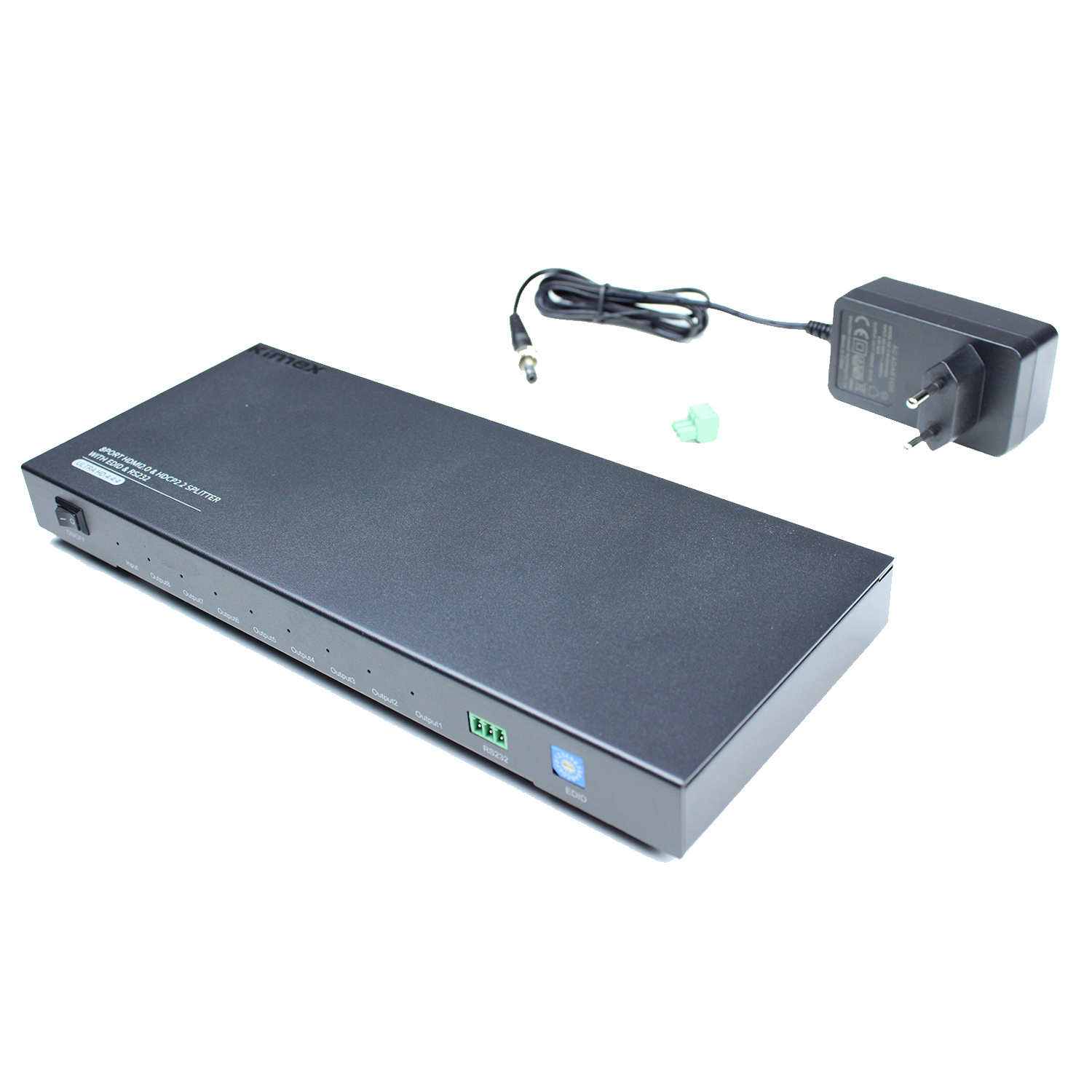 Un dispositivo negro con múltiples puertos y un adaptador de corriente en una superficie blanca.