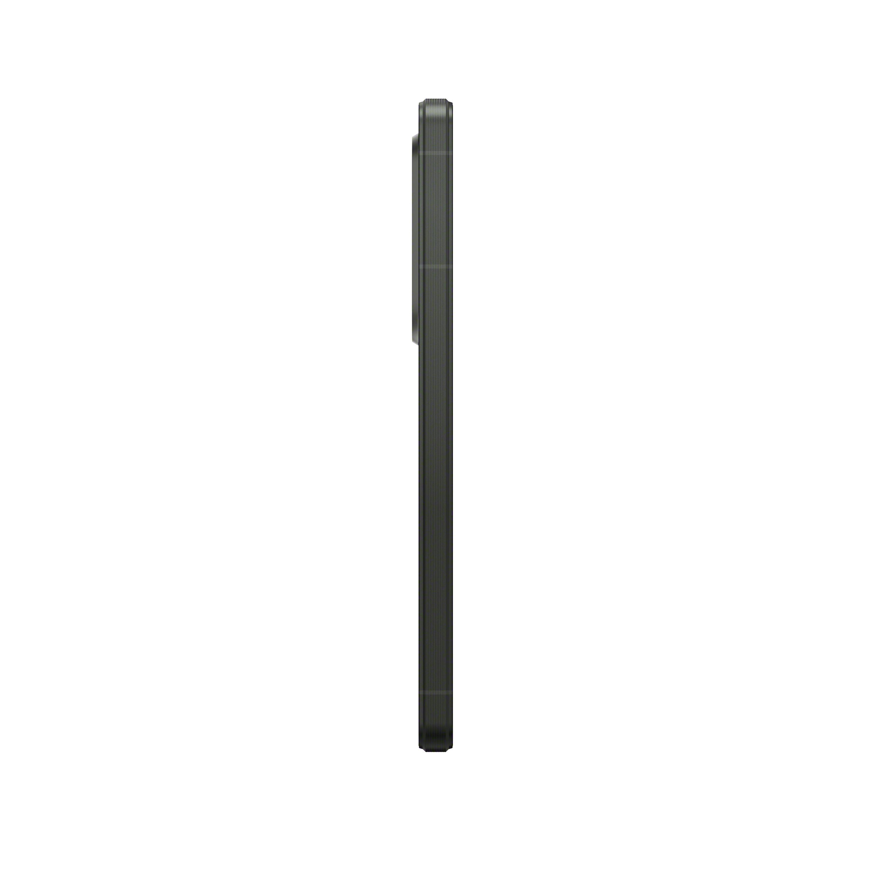 Teléfono oscuro, vista lateral. El teléfono es negro y tiene un módulo de cámara.
