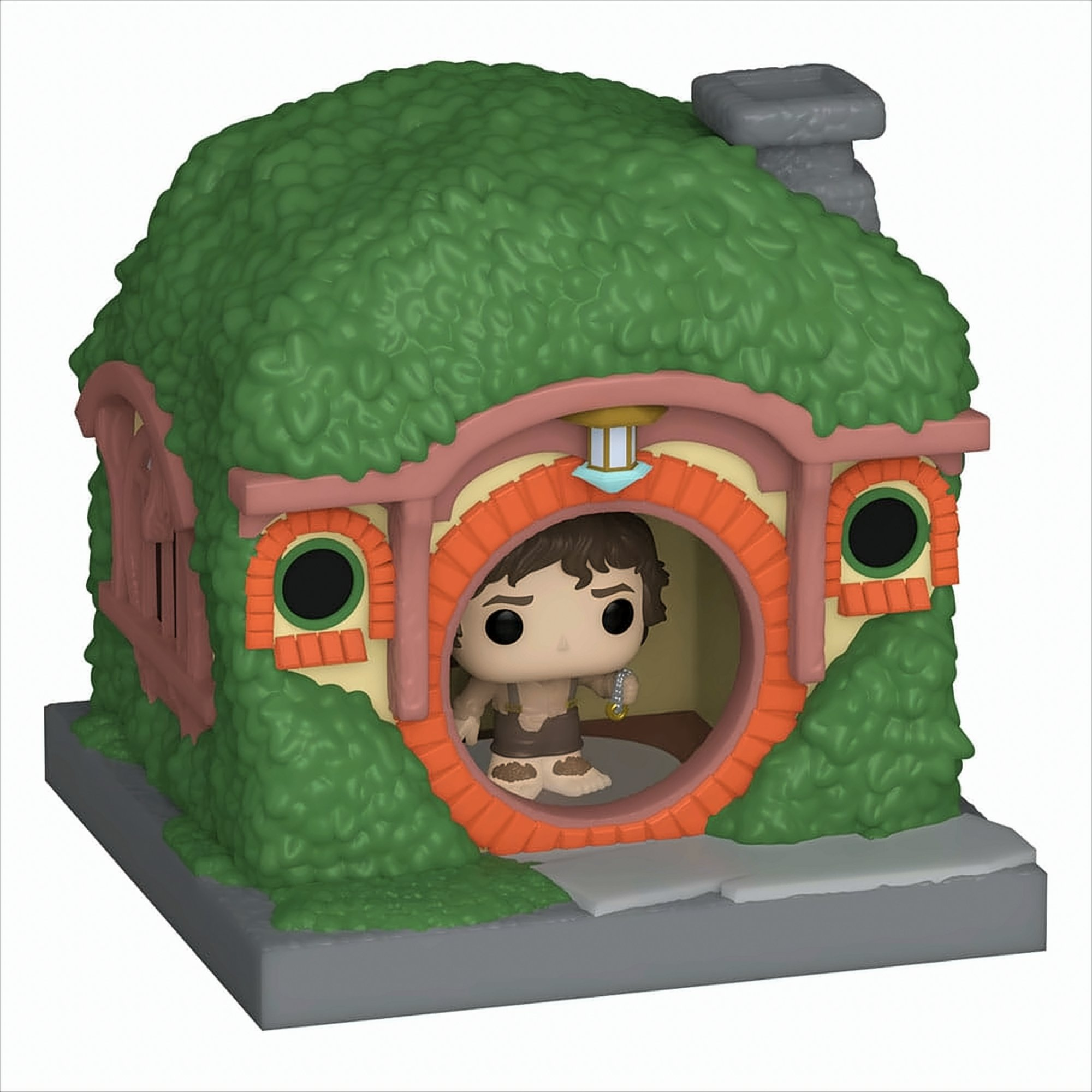 Funko Pop Figur von Frodo Beutlin in einem Hobbit-Loch. Grünes, blättriges Äußeres mit einer runden Tür.