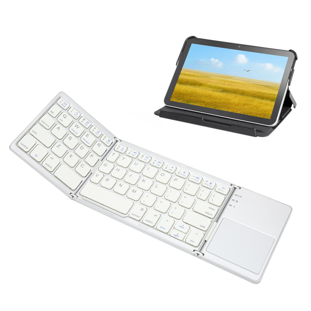 Faltbare silberne Tastatur mit Tablet auf einem Ständer. Das Tablet zeigt ein gelbes Feld und blauen Himmel.
