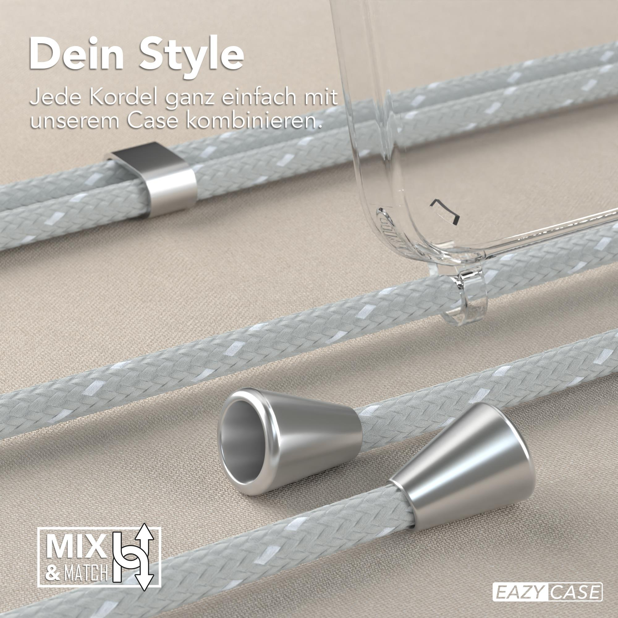 Nahaufnahme einer transparenten Handyhülle und grauen geflochtenen Kordeln mit Metallakzenten.