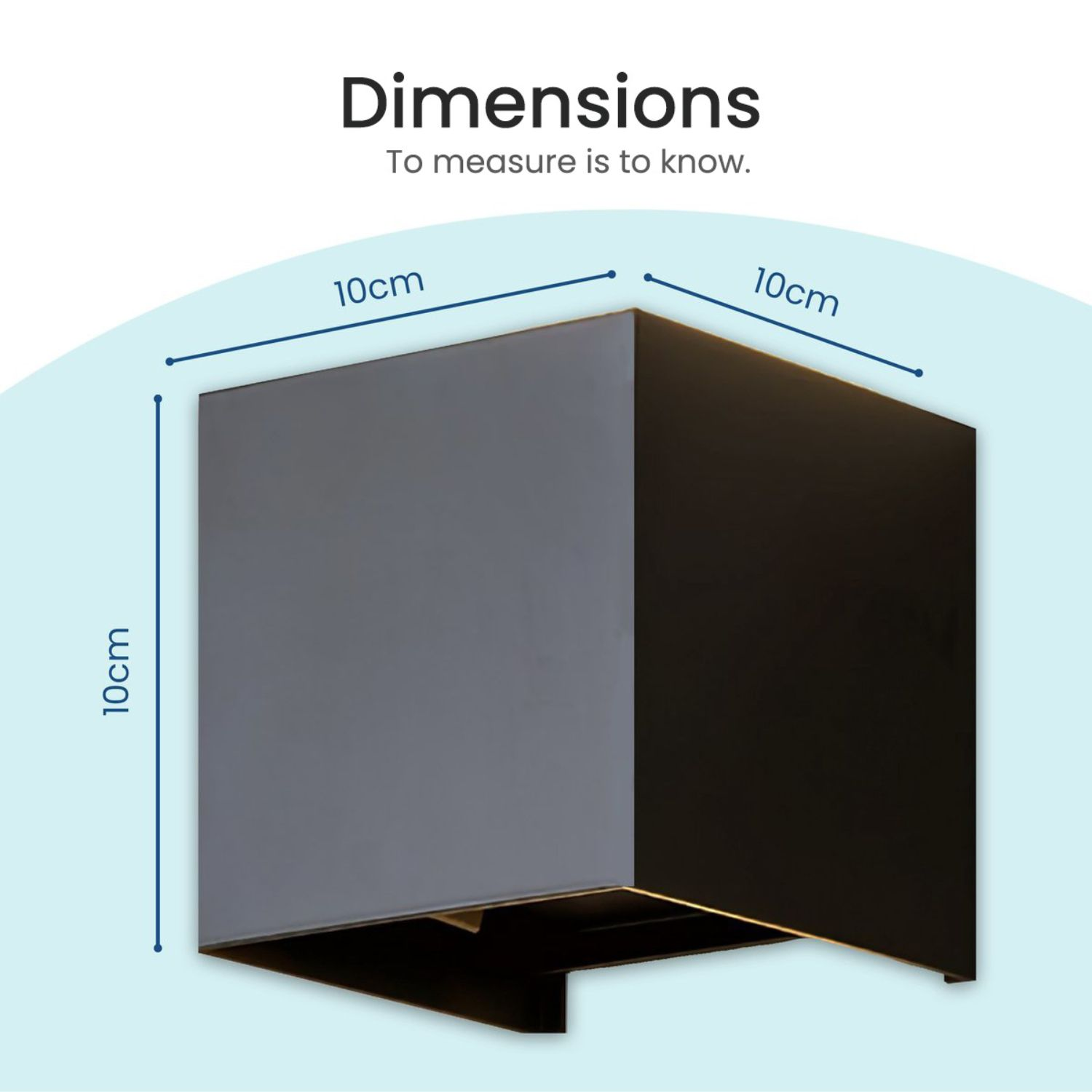 A gray and black cube with dimensions labeled in blue lines against a light blue backdrop.