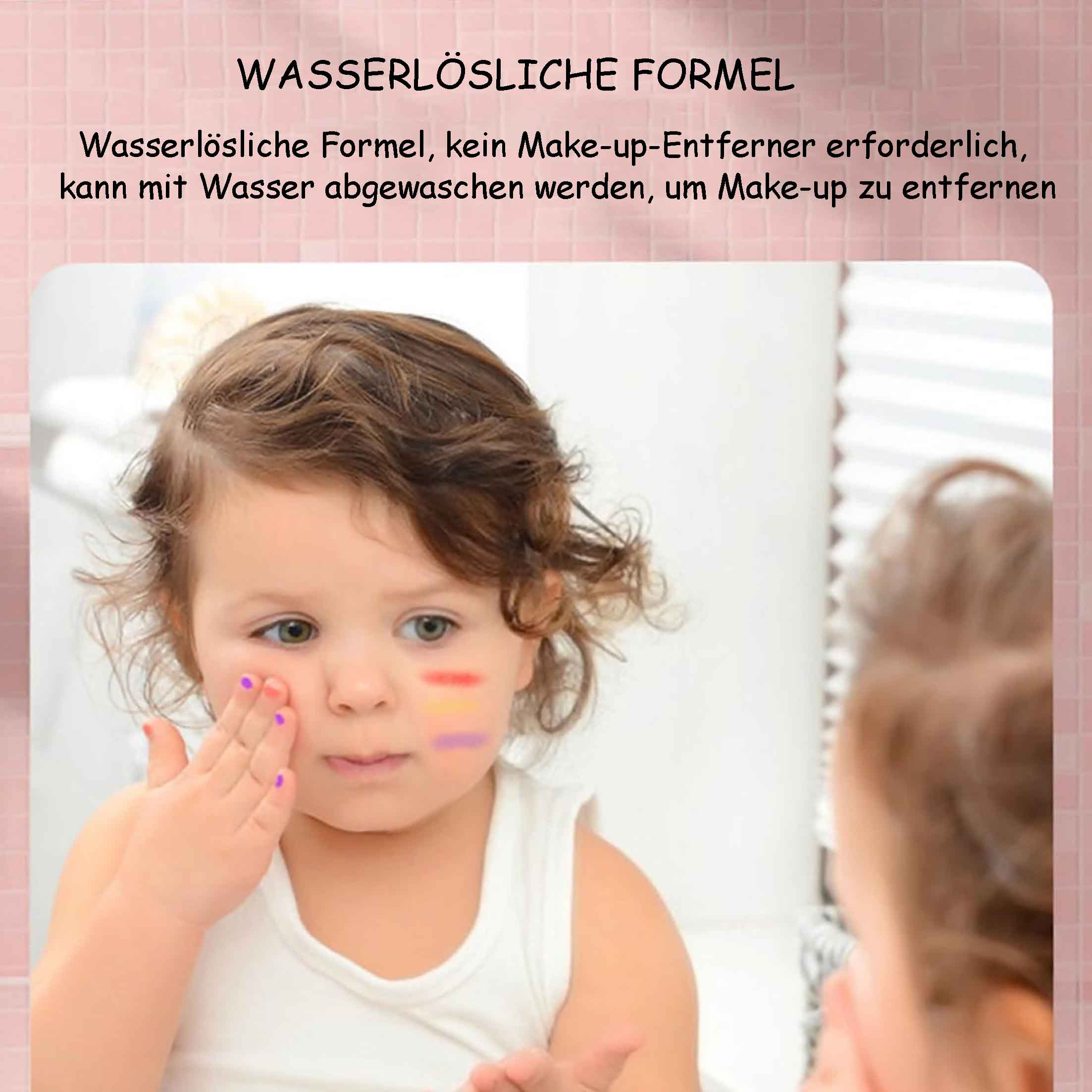 Ein Baby mit bemaltem Gesicht vor einem Spiegel, rosa Hintergrund.
