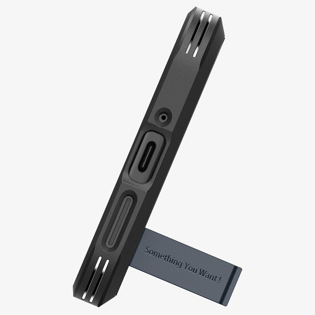Eine schwarze Handyhülle mit einem Ständer. Auf dem Ständer steht: „Something You Want!"