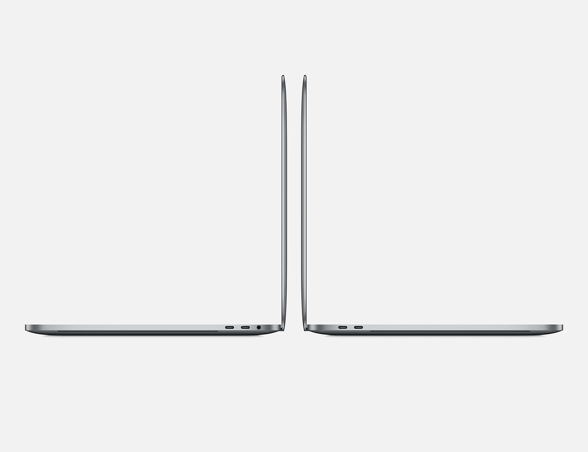 Zwei graue Laptops nebeneinander, von der Seite betrachtet, auf weißem Hintergrund, sauber und minimalistisch.