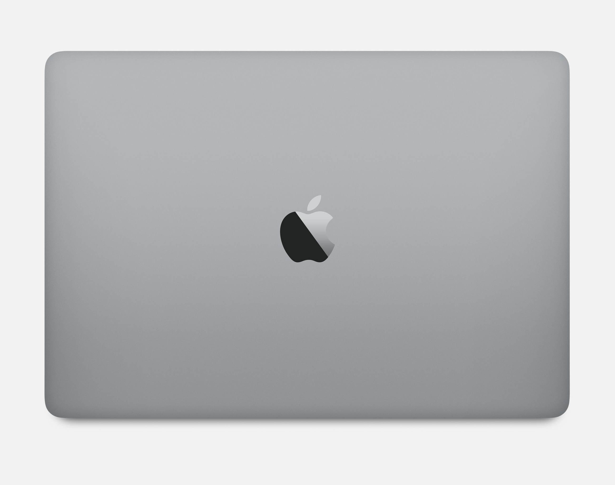 Srebrny laptop, pokazujący logo Apple na tylnej obudowie.