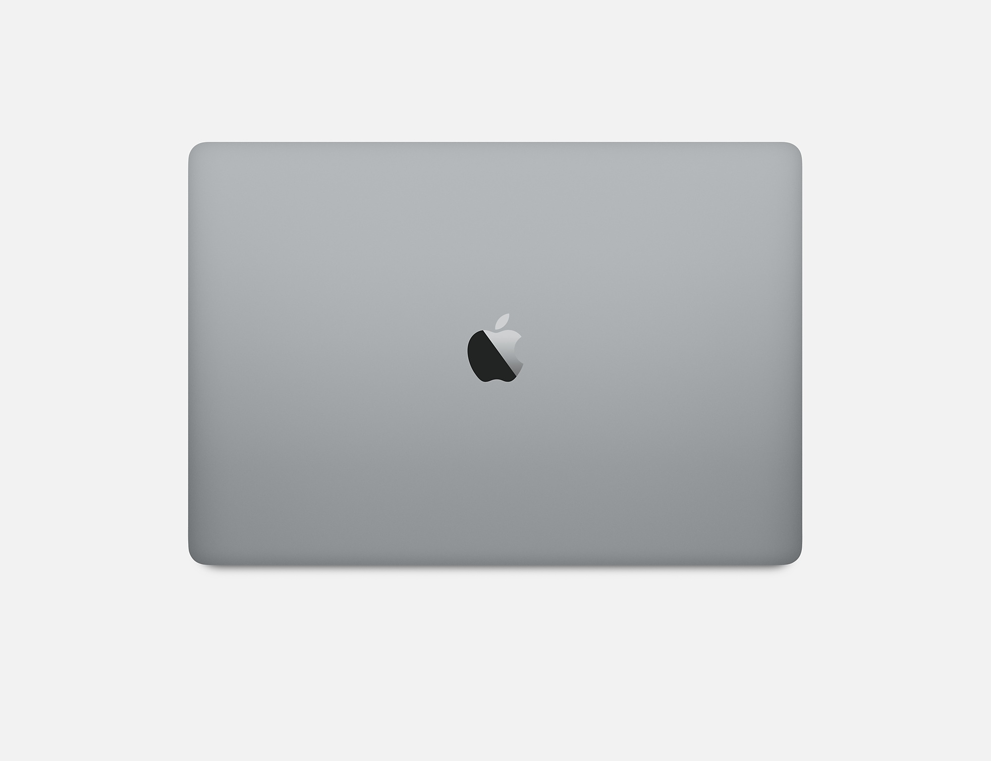 Zamknięty szary laptop z logo Apple na pokrywie, na białym tle.