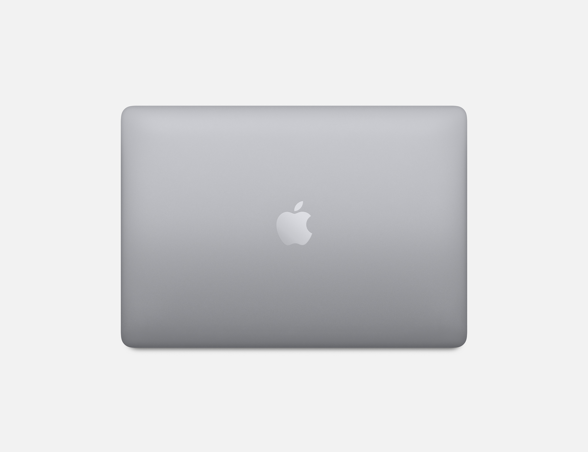 Widok z góry na laptopa z logo Apple na szarej powierzchni.