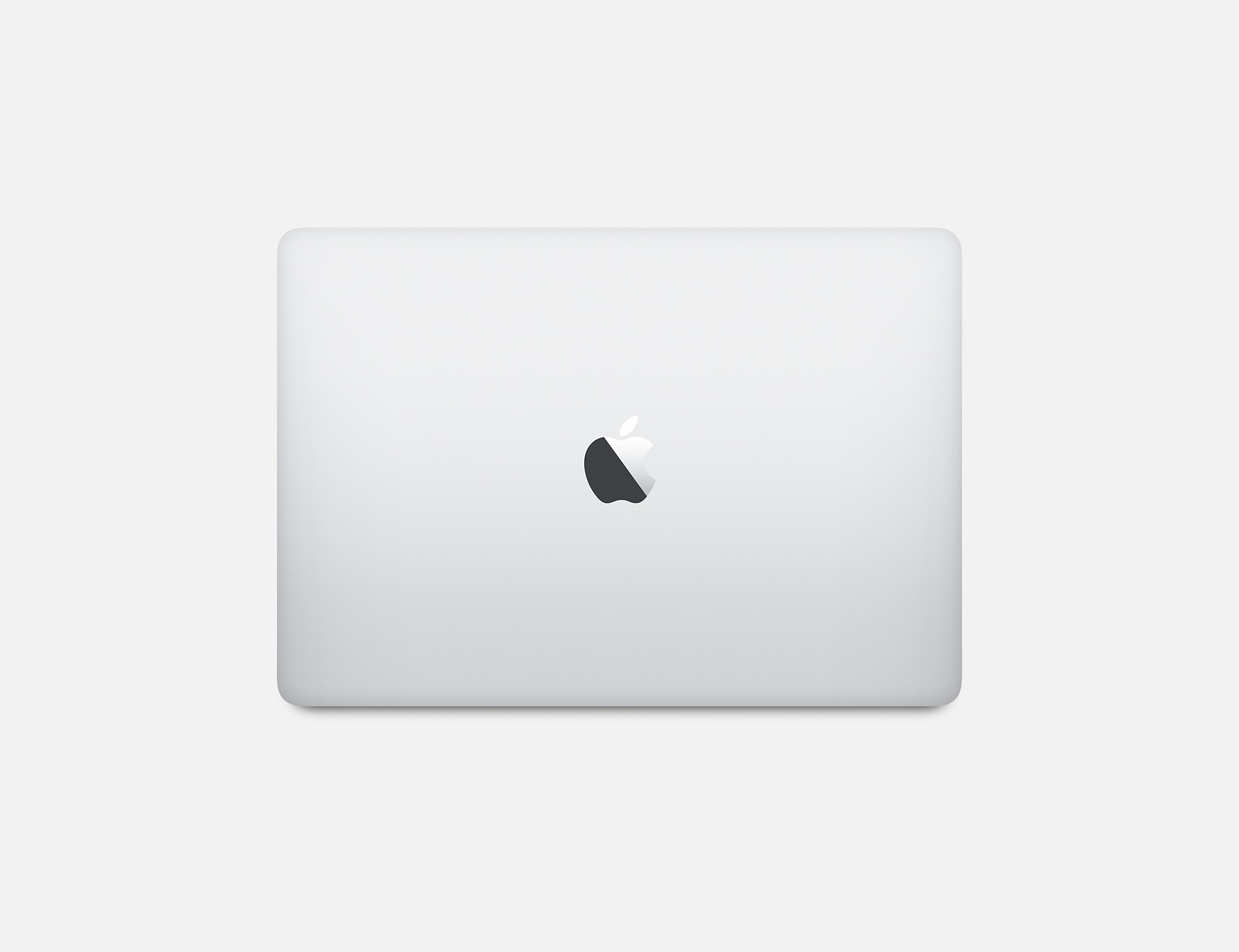Portátil plateado con el logo de Apple en la tapa cerrada, sobre fondo blanco.