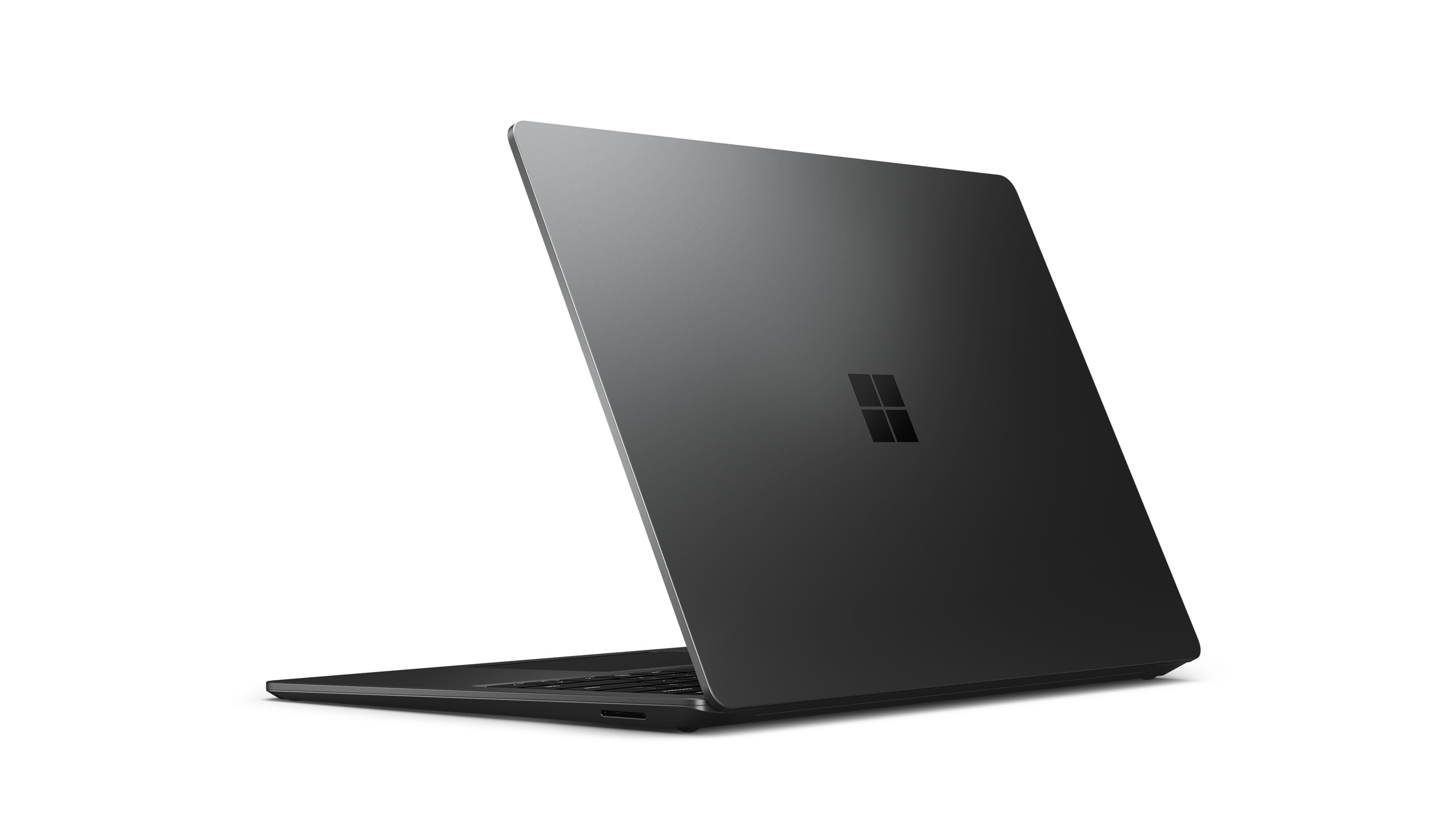 Laptop nero con logo Microsoft. Vista angolata, chiuso, che mostra superficie nera.