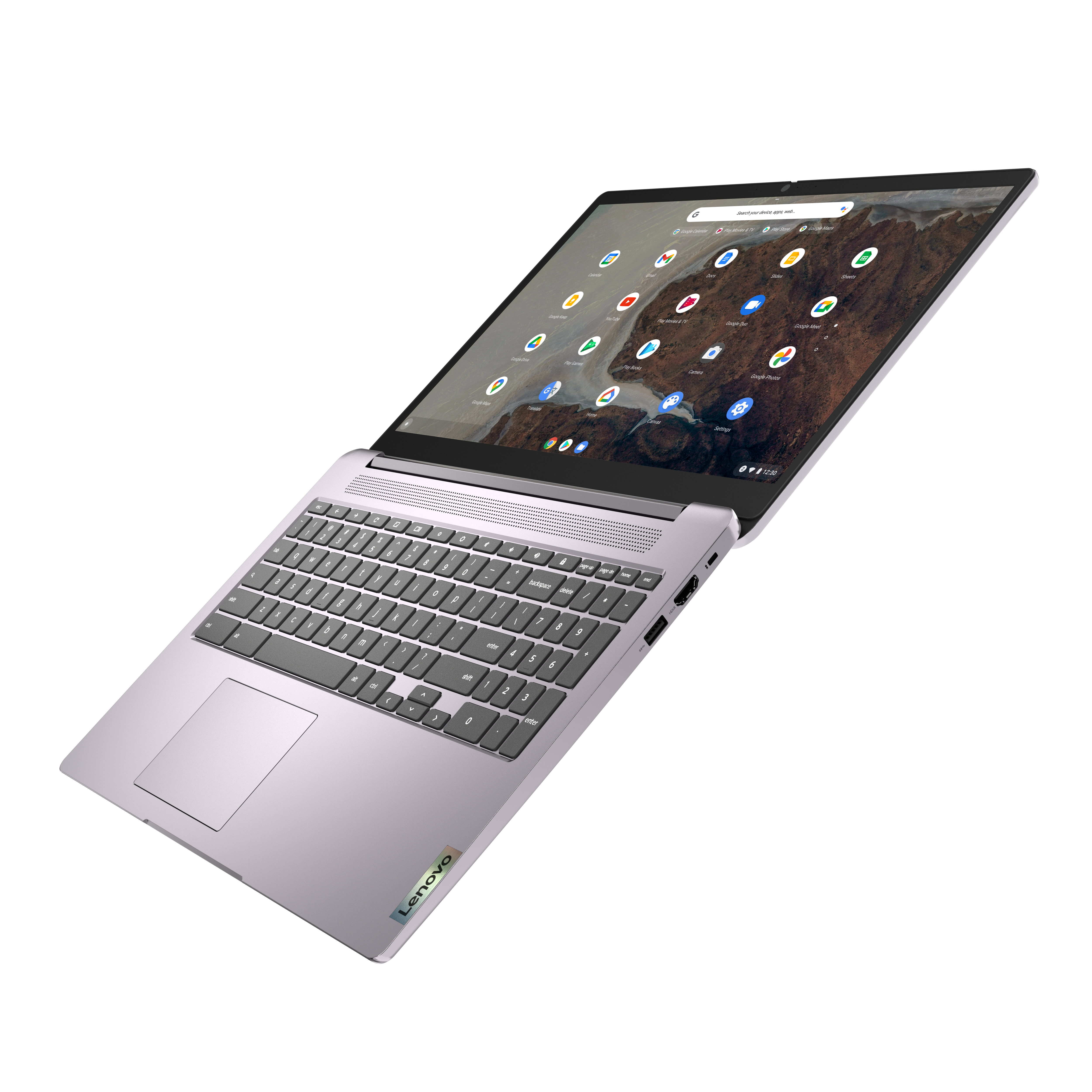 Srebrny laptop Lenovo Chromebook, otwarty, widok pod kątem. Ekran wyświetla interfejs Google Chrome.