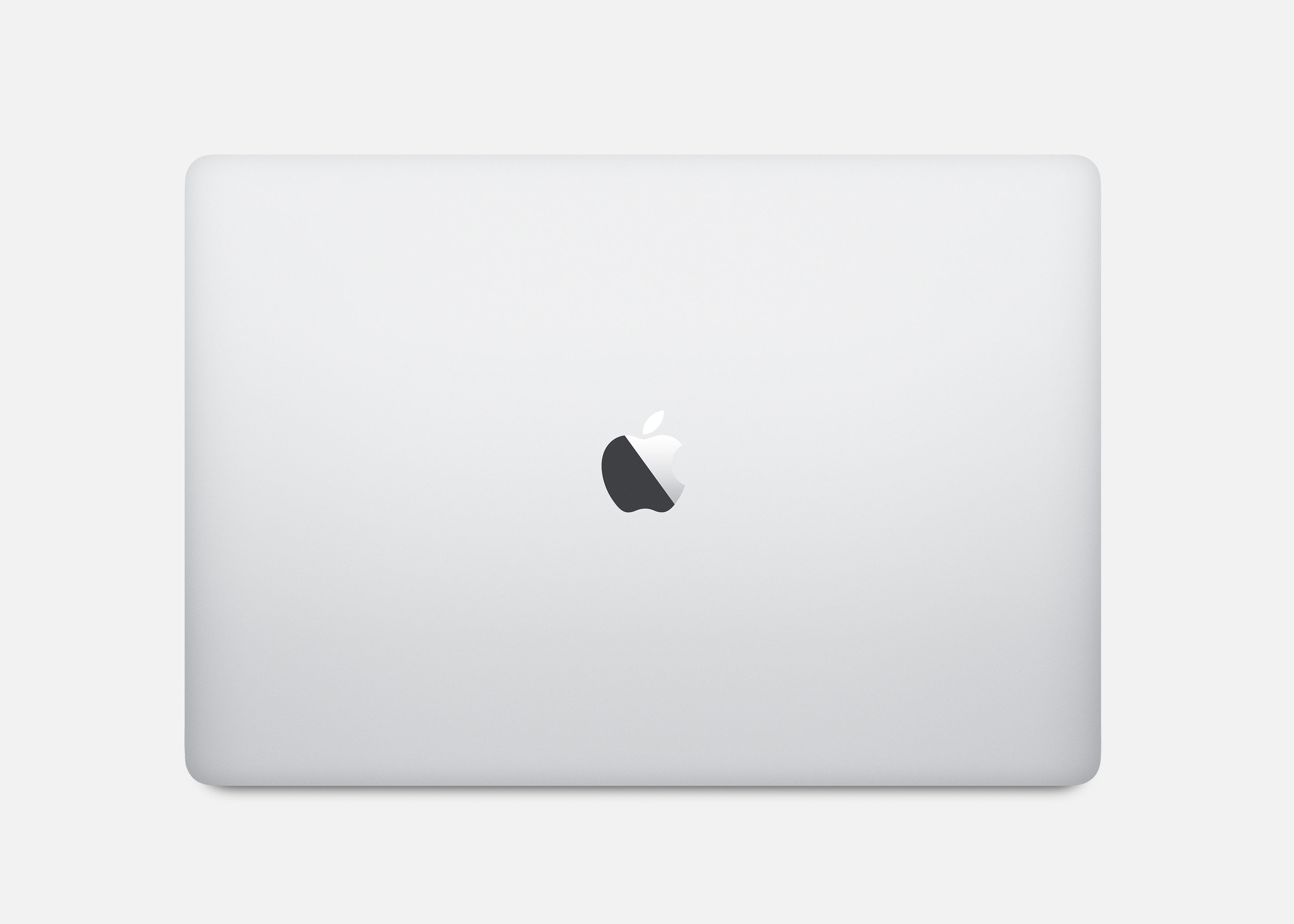 Un laptop bianco, chiuso, con logo Apple sul coperchio, su sfondo bianco.