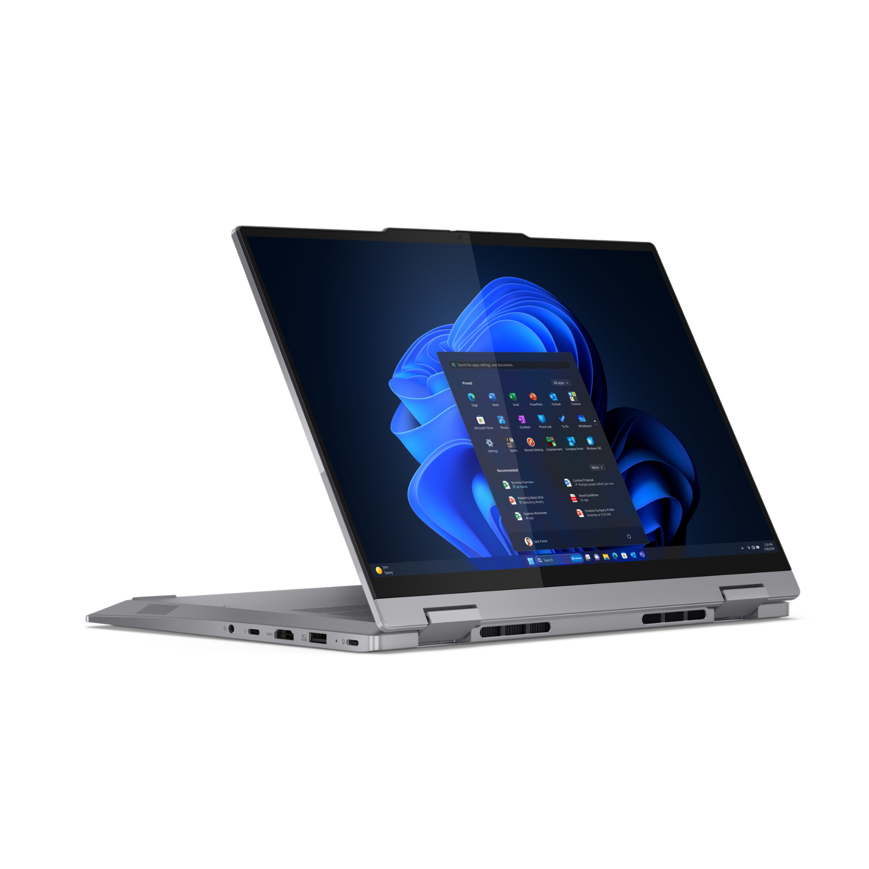 Ein silberner Laptop mit geöffnetem Bildschirm, der einen blauen Hintergrund und App-Symbole anzeigt. Er ist leicht geöffnet.