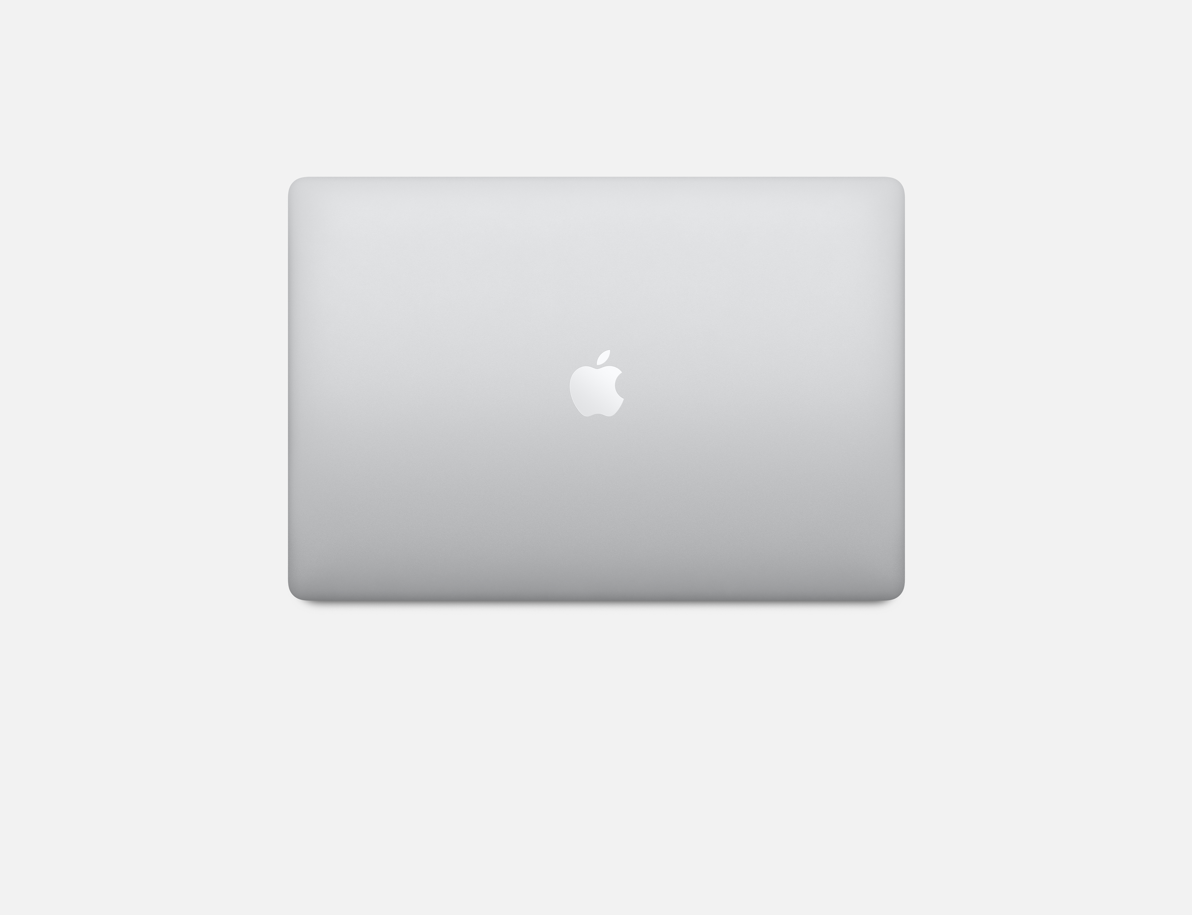 Tył srebrnego MacBooka, ze znakiem Apple pośrodku, na białej powierzchni.