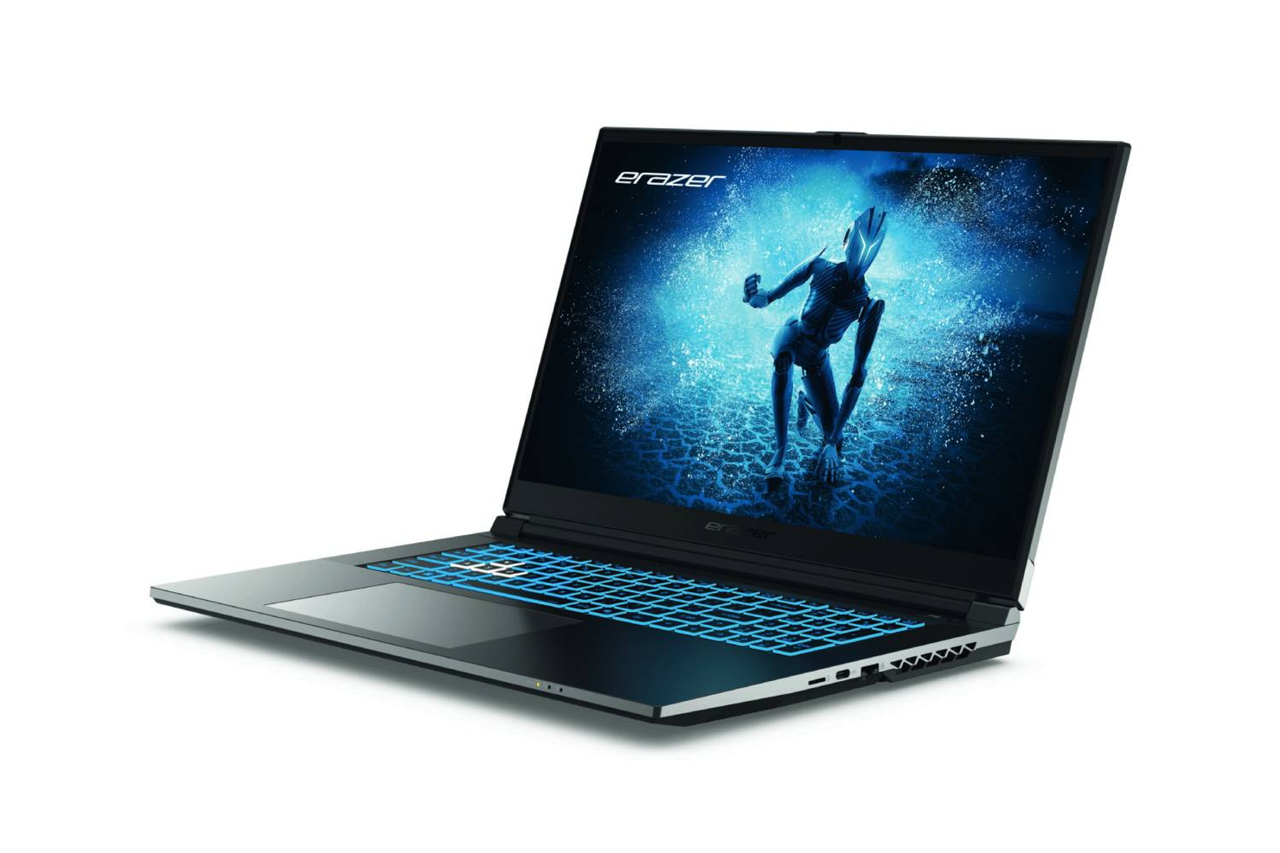 Un portátil gaming negro y azul está abierto sobre una superficie blanca.