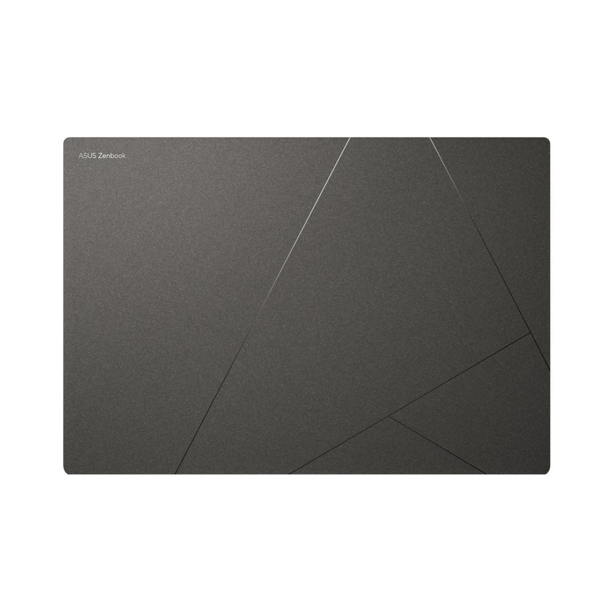 Panel táctil gris oscuro con un diseño geométrico sutil. La superficie tiene una textura mate.