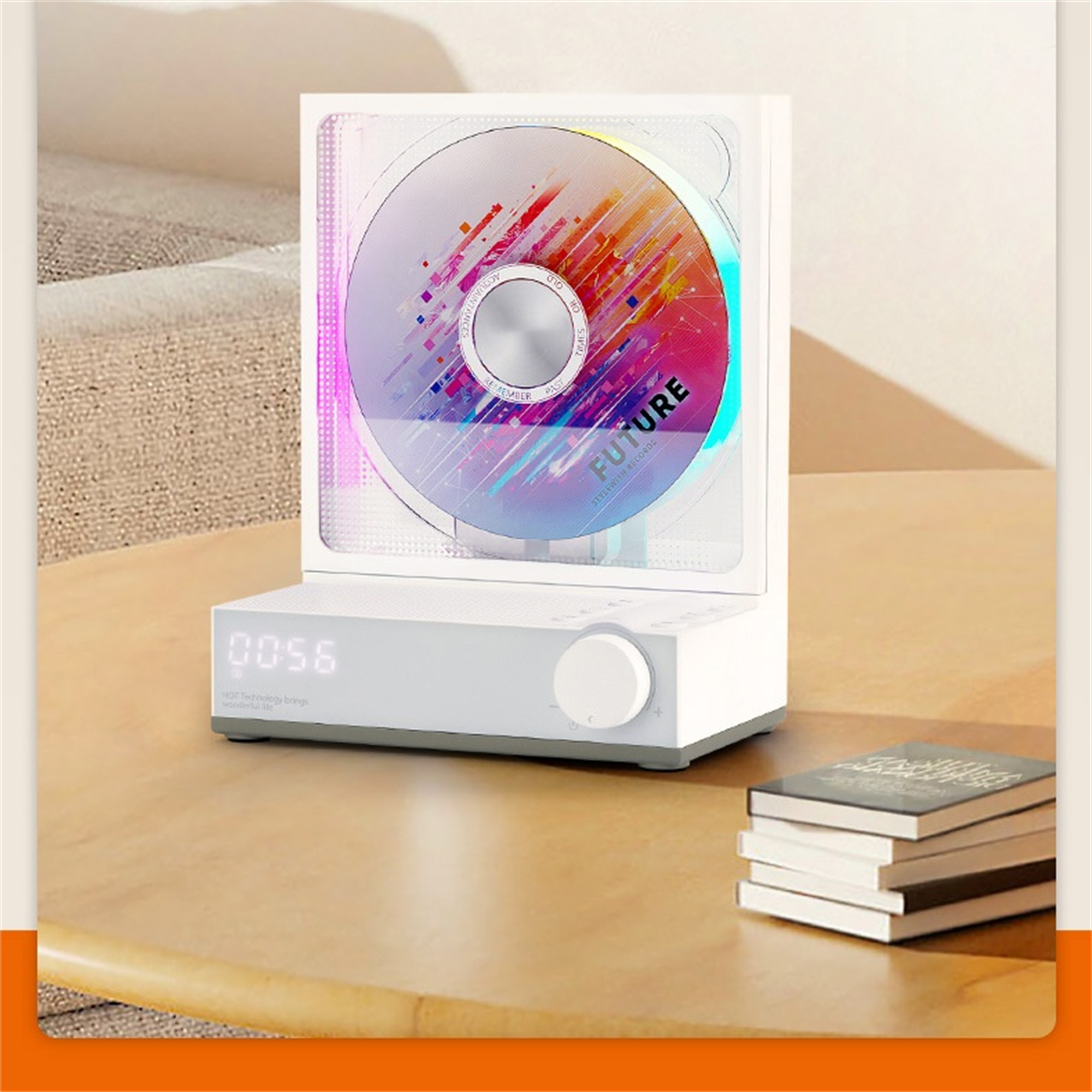 Ein weißes Gerät mit einer CD-ähnlichen Scheibe, auf einem Tisch mit Büchern. Der Text FUTURE ist sichtbar.