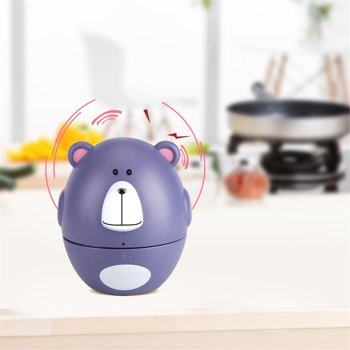 Ein lila bärenförmiger Timer auf einem Tisch, mit Schallwellen, die seine Aktivität anzeigen.