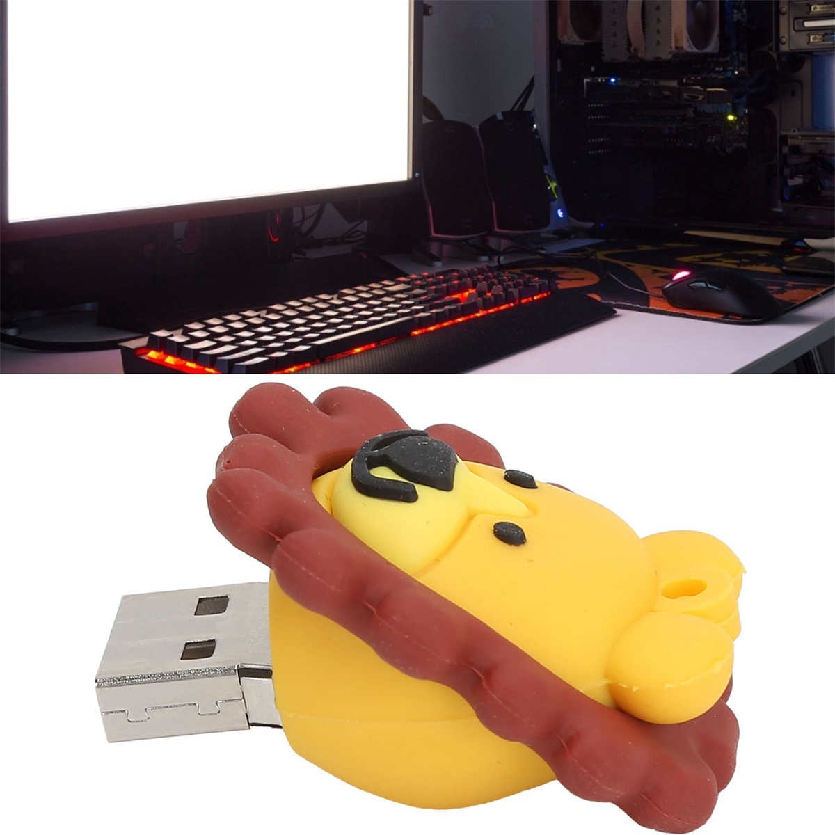 Ein Desktop mit Computer und Tastatur. Ein USB-Stick in Löwenform ist im Vordergrund.