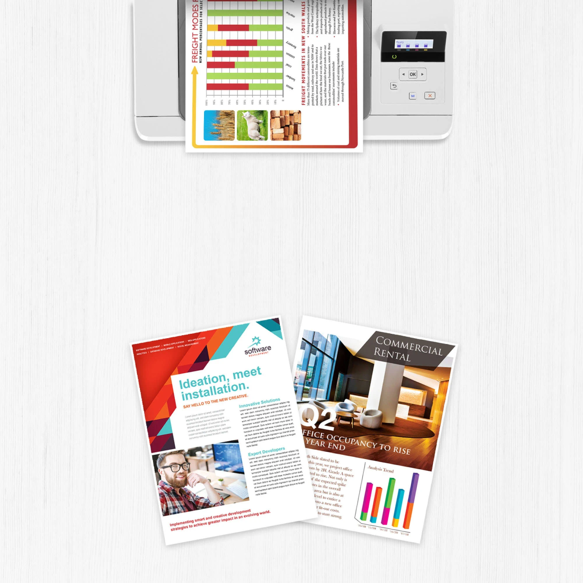 Drukarka drukująca dokumenty z wykresami i tabelami na drewnianym stole.