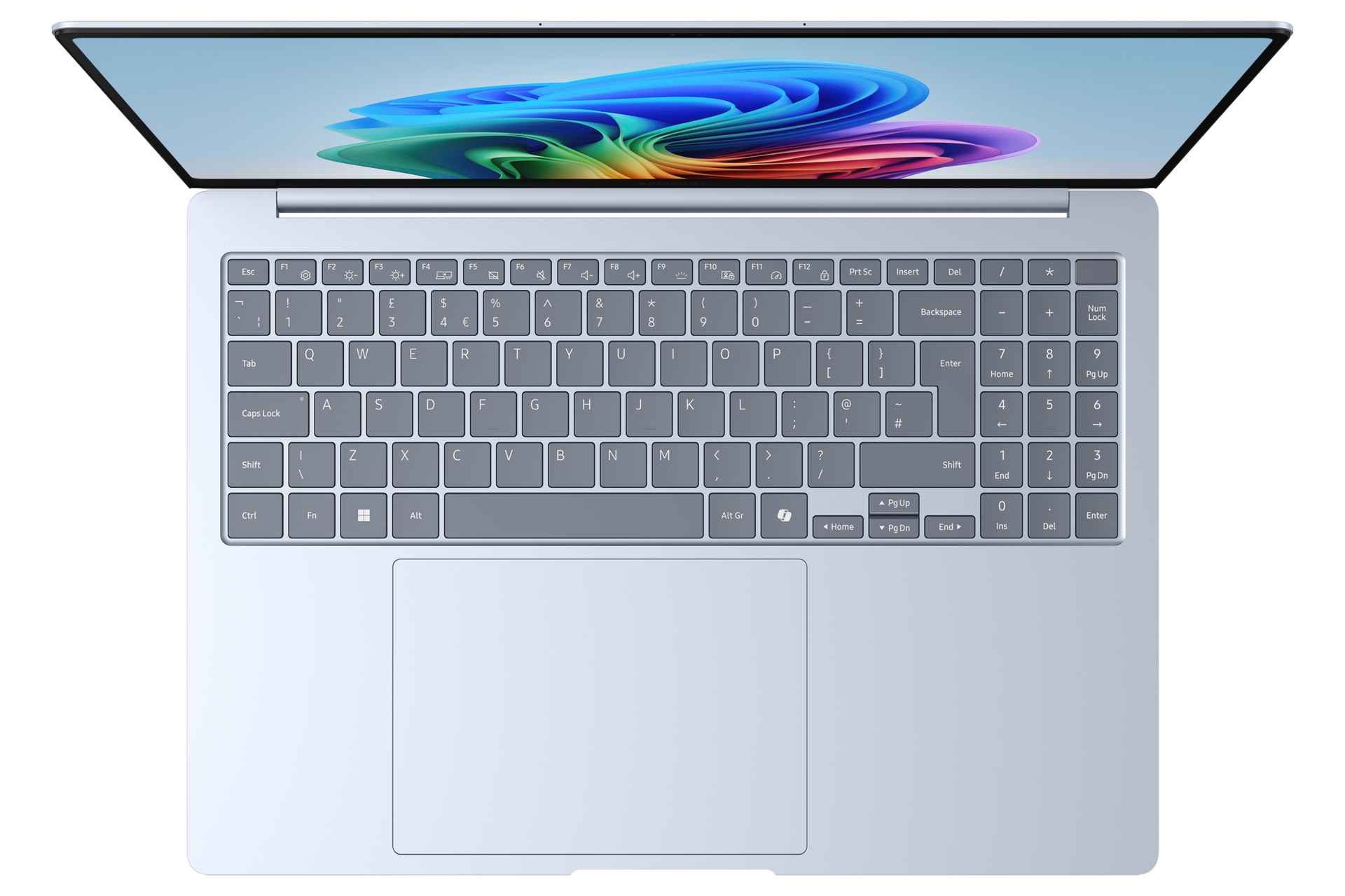 Widok z góry na srebrny laptop z kolorowym, abstrakcyjnym obrazem na ekranie.