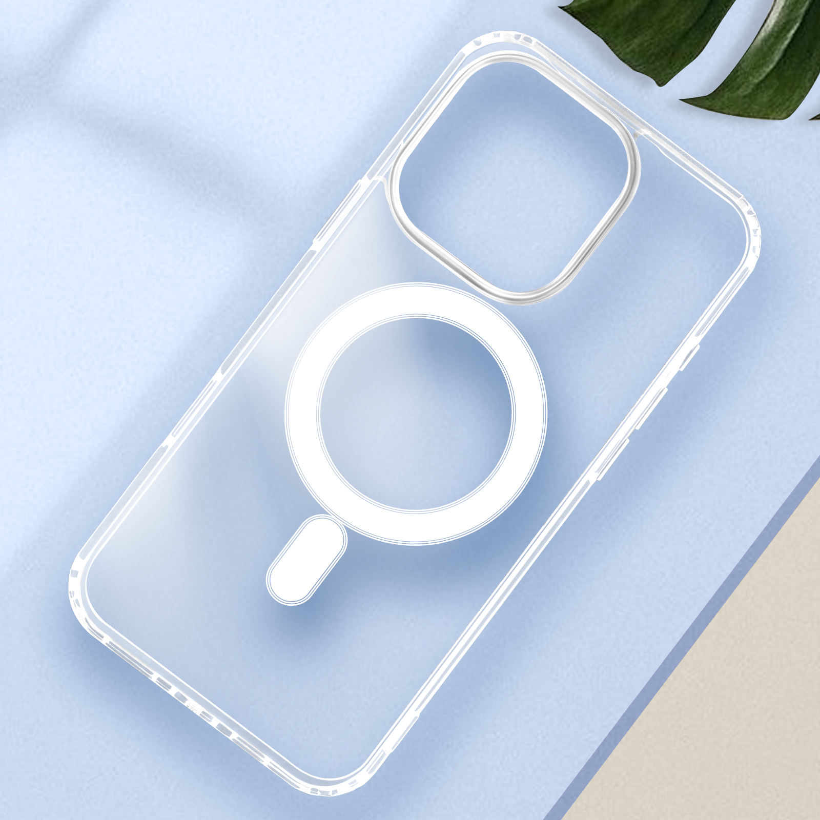 Una custodia trasparente per iPhone con un magnete circolare bianco al centro. È su una superficie blu.