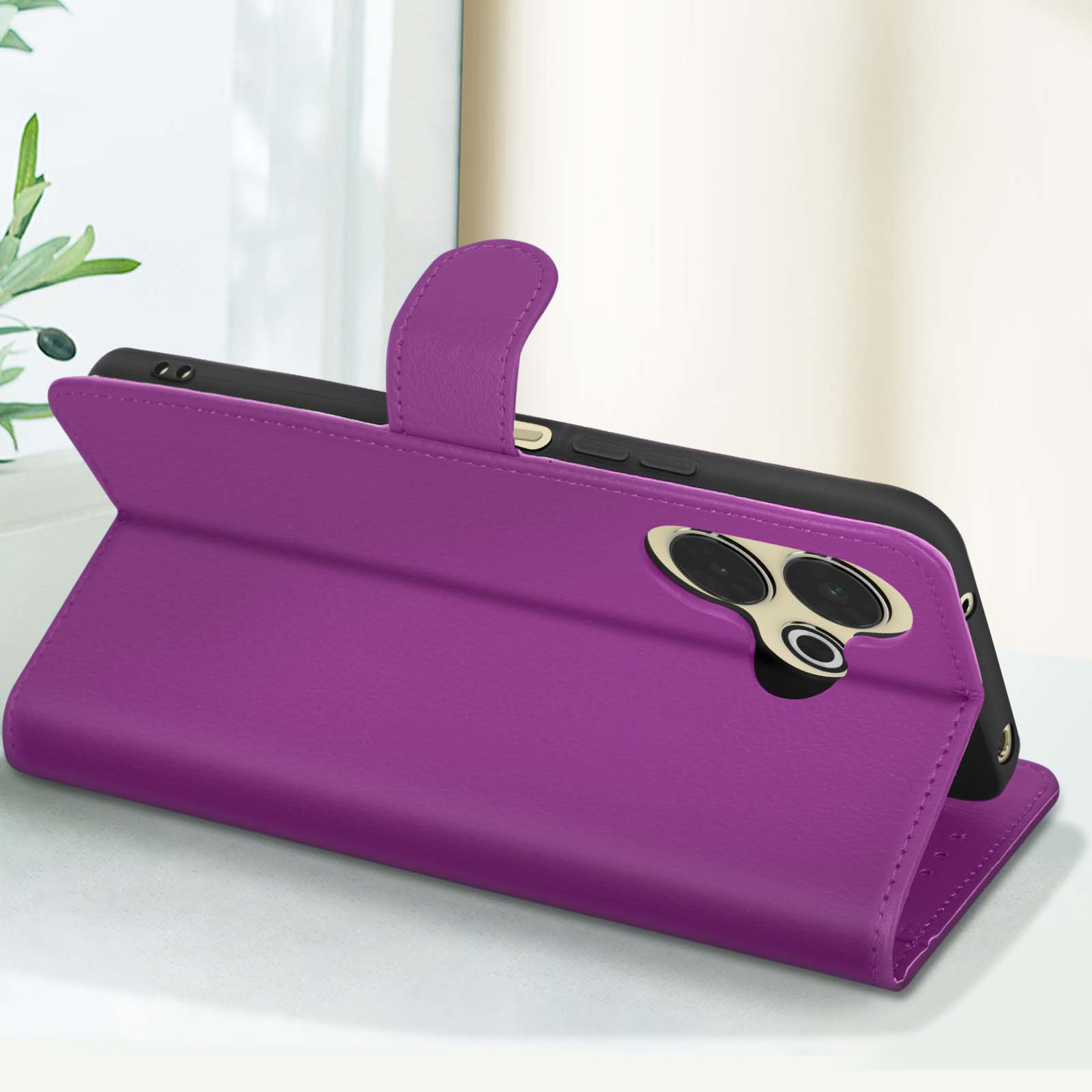 Custodia viola per telefono aperta, con un telefono all'interno. La custodia è su un tavolo.