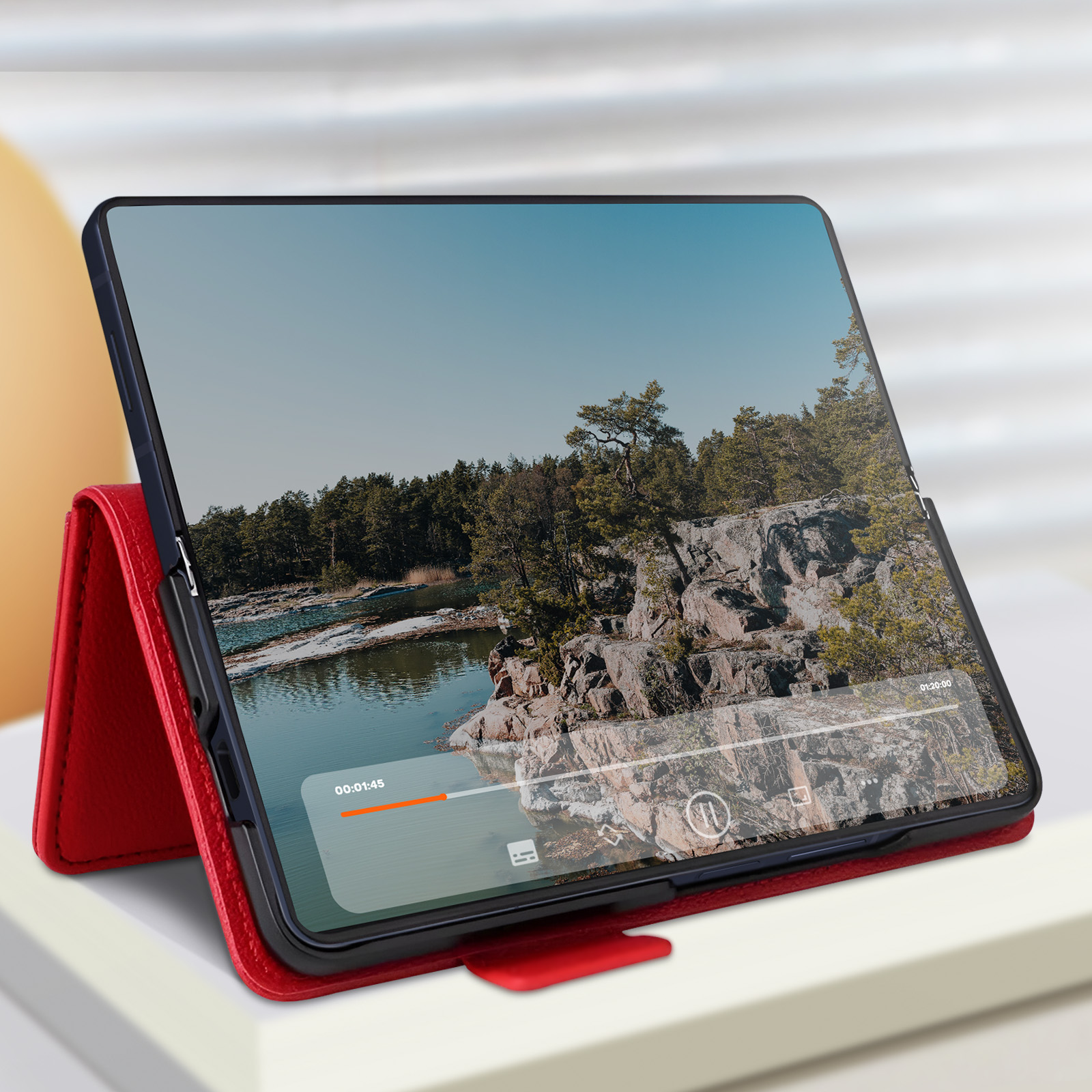 Tablet in rotem Gehäuse. Zeigt ein Video einer Landschaft mit sichtbarem Timer.