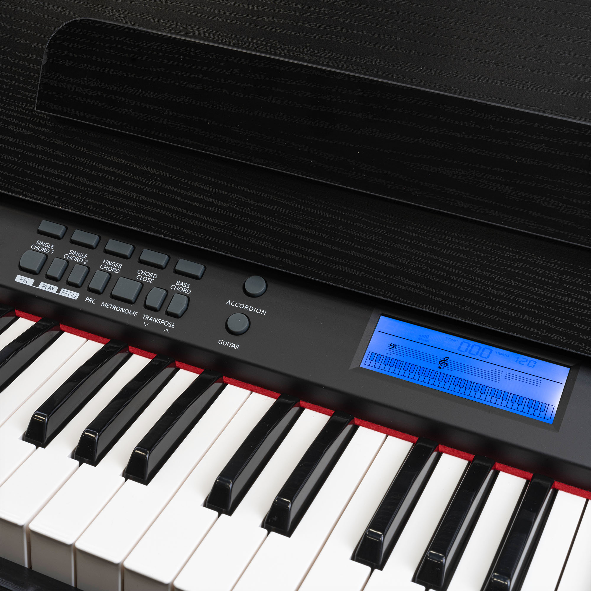 Nahaufnahme eines schwarzen Klaviers mit weißen Tasten und einem blauen Digitaldisplay. Die Tastatur steht im Fokus.