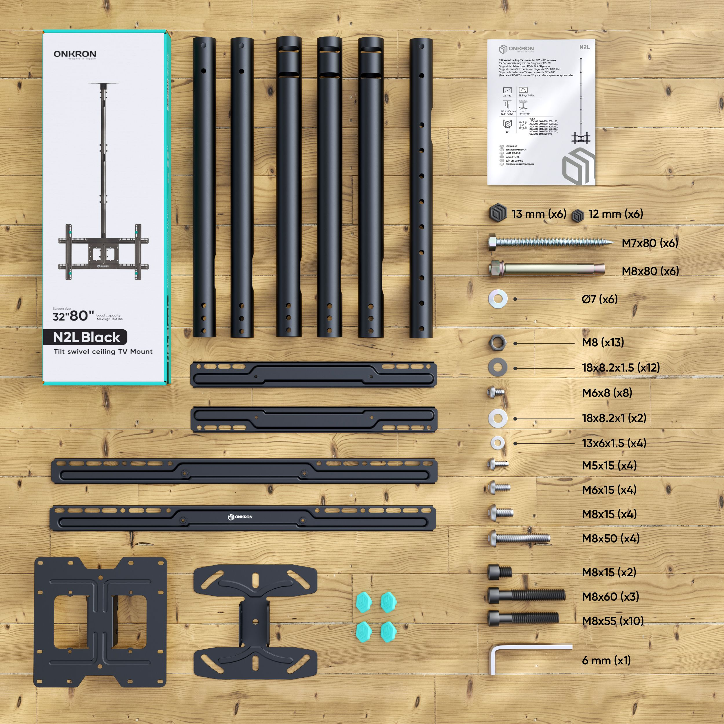 Un kit di montaggio TV con parti, testo e un diagramma, posto su una superficie di legno.