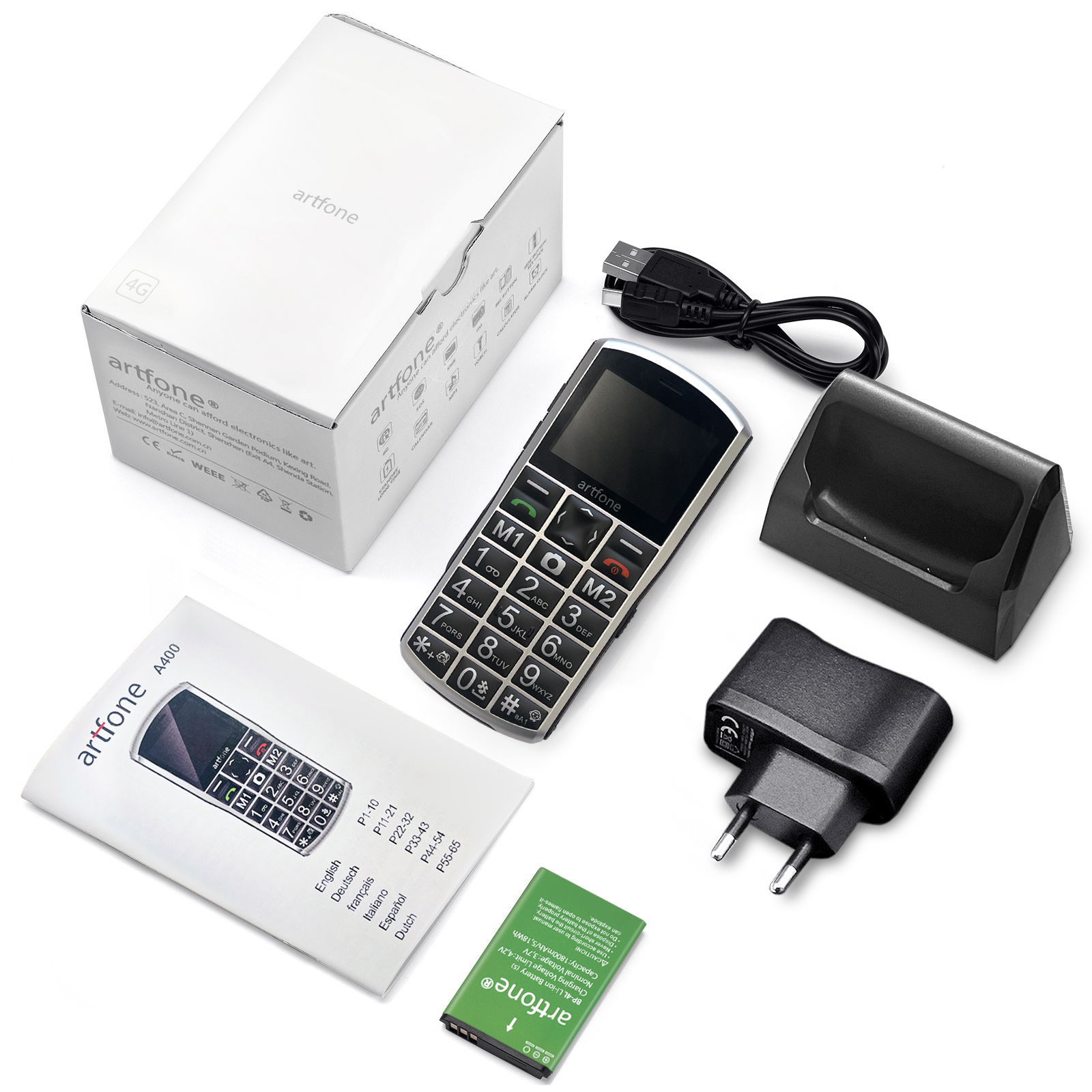 Un telefono, caricabatterie, batteria e altri accessori sono disposti su una superficie bianca.