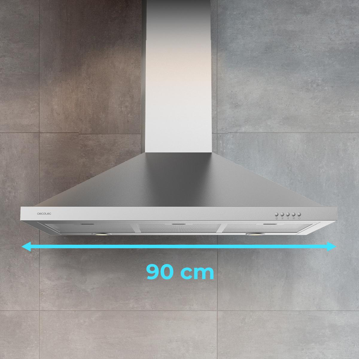 Campana extractora de acero inoxidable en pared de azulejos grises, 90 cm ancho indicado.