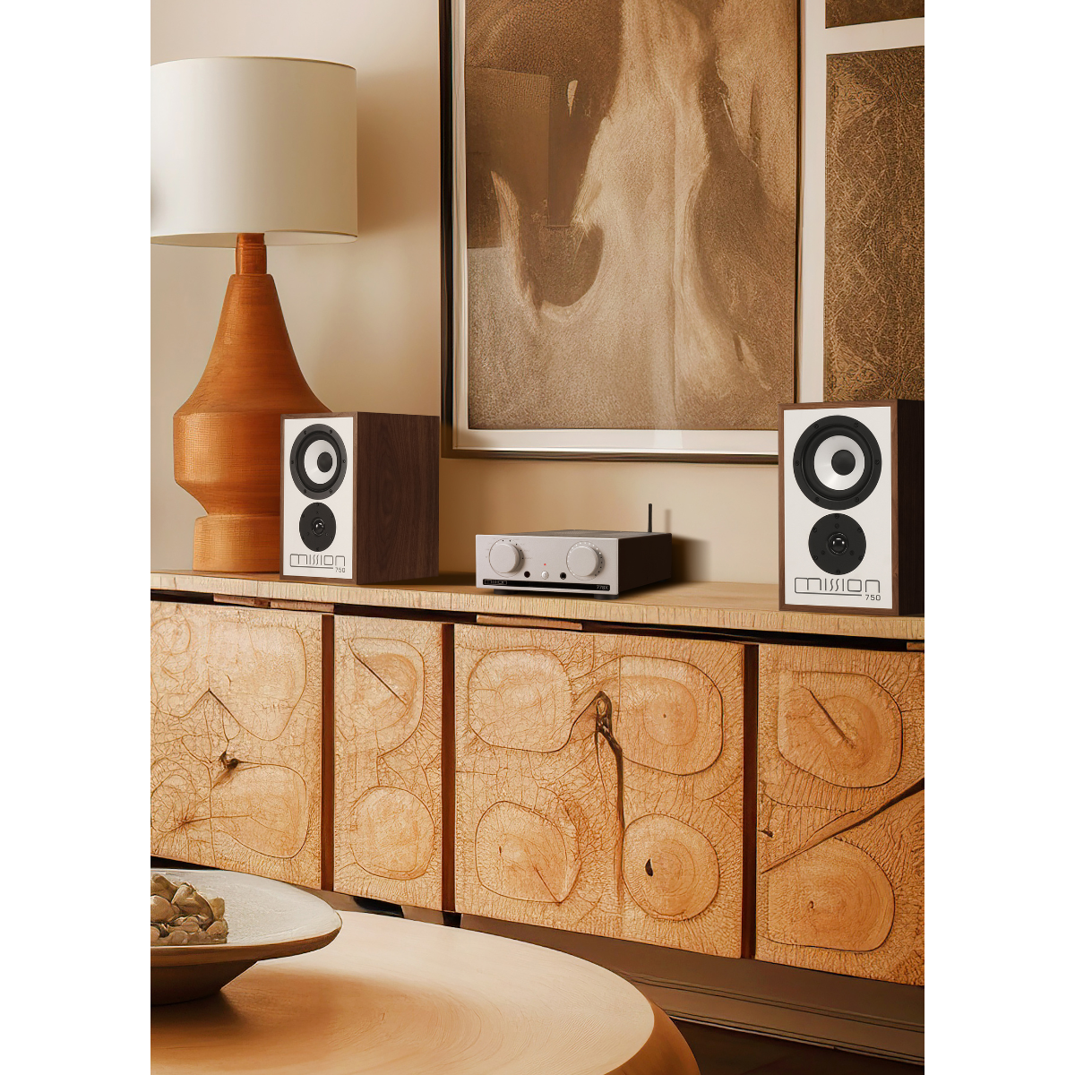 A living room scene with speakers on a cabinet, a lamp, and a painting on the wall.