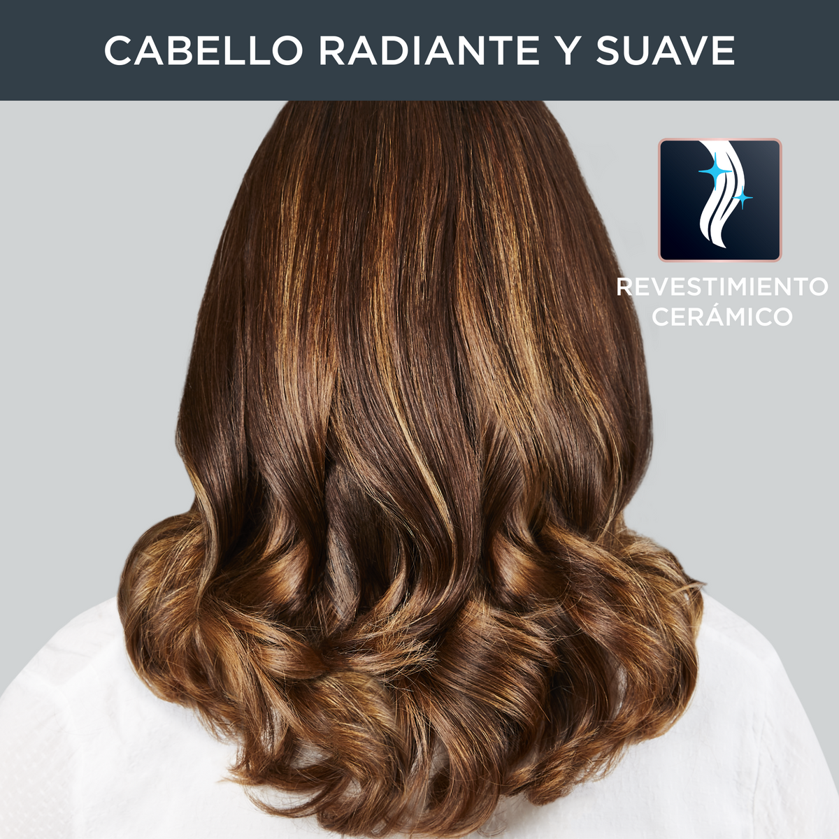 Rücken einer Frau, braunes Haar mit blonden Highlights, mit Wellen gestylt.