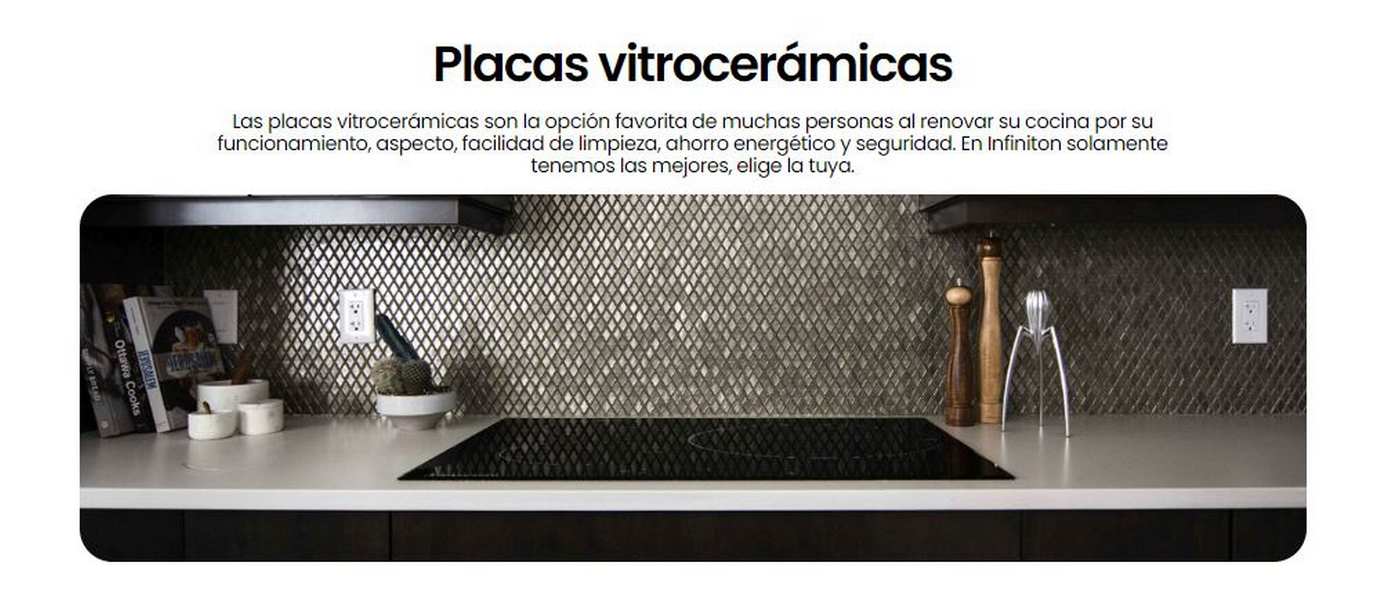 Una cocina con vitrocerámica negra, encimera y salpicadero de azulejos.