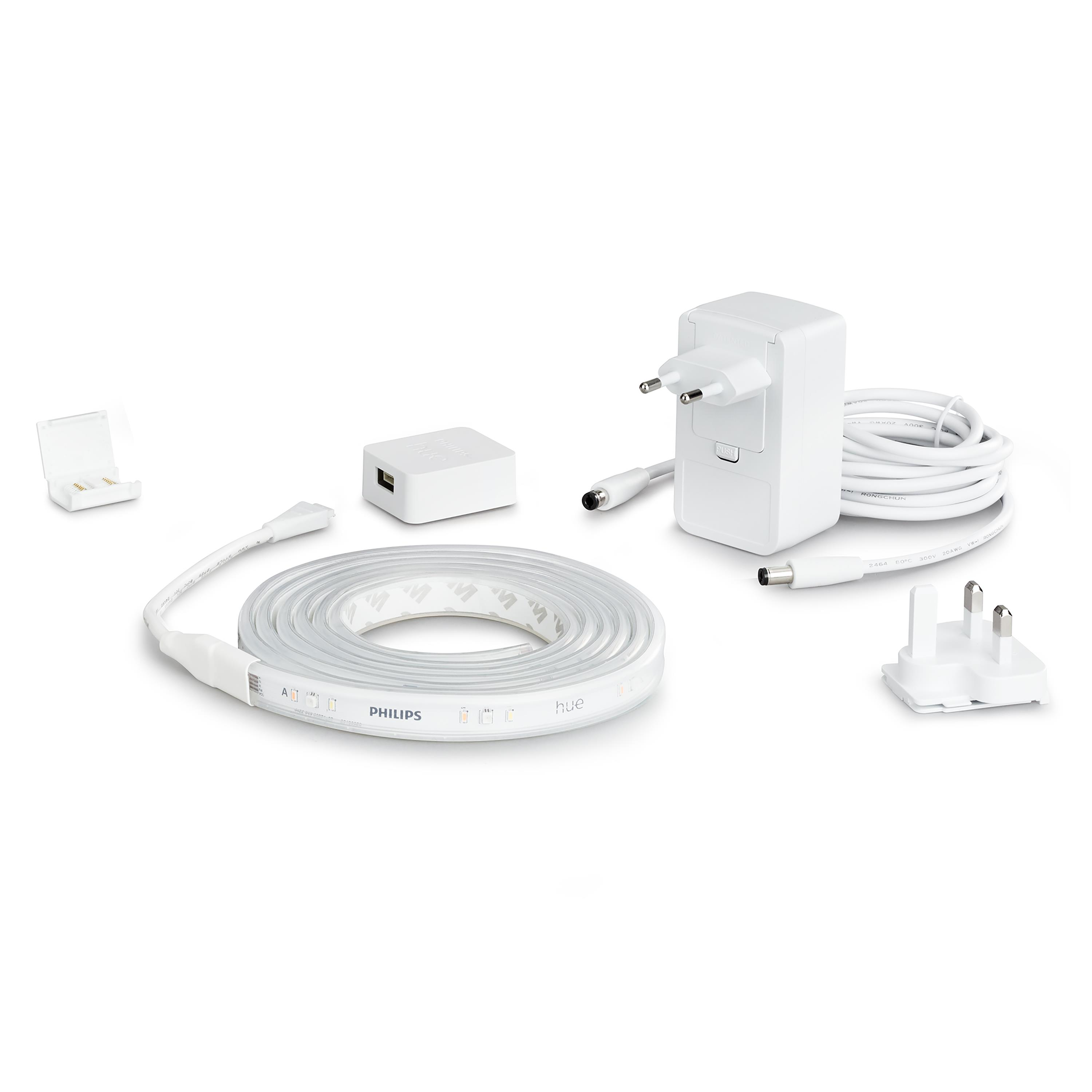 Tira de luz blanca Philips Hue con varios accesorios, incluyendo una fuente de alimentación y conectores.