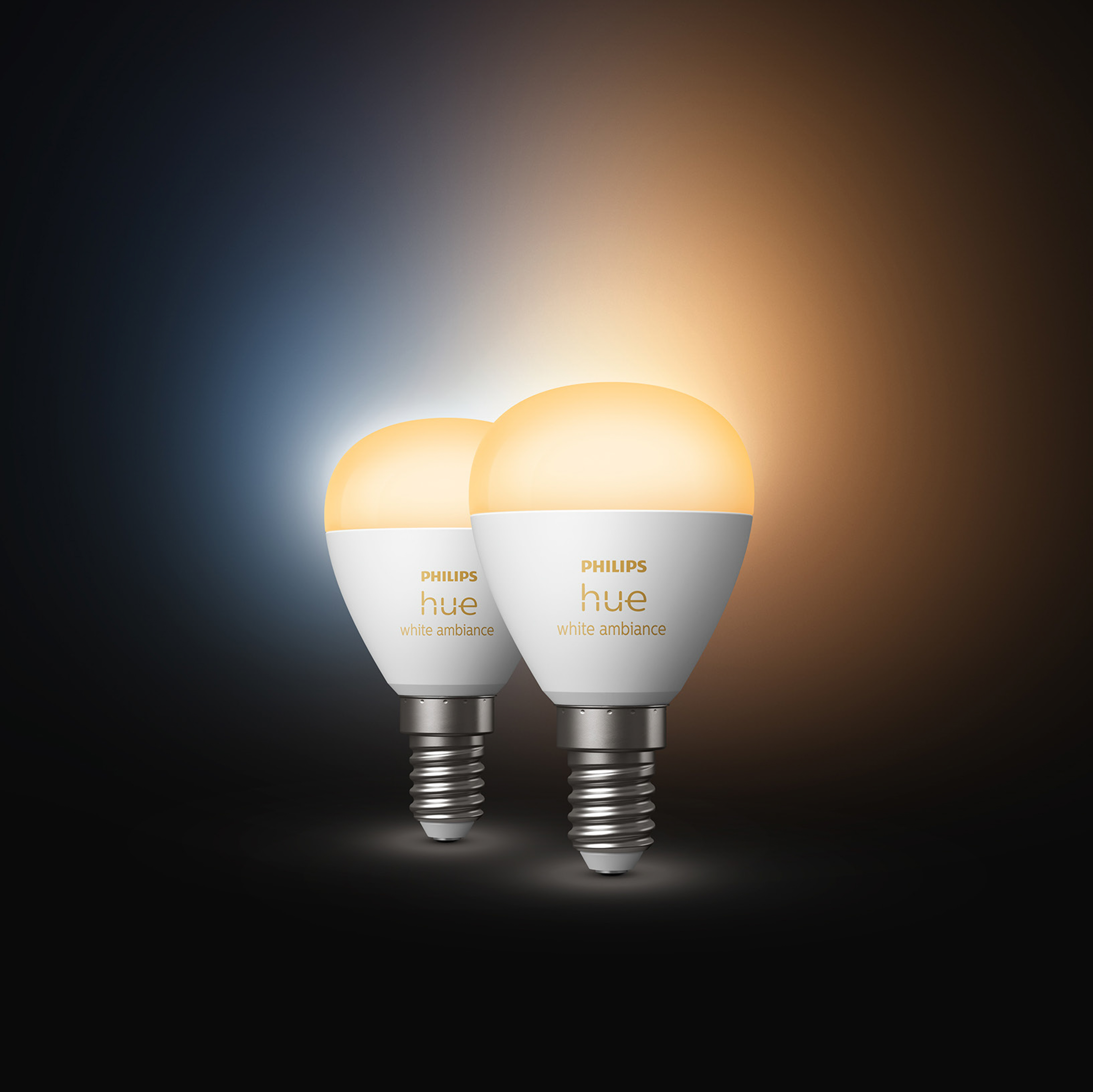 Dwie inteligentne żarówki Philips Hue, biały nastrój, z logo Philips Hue.